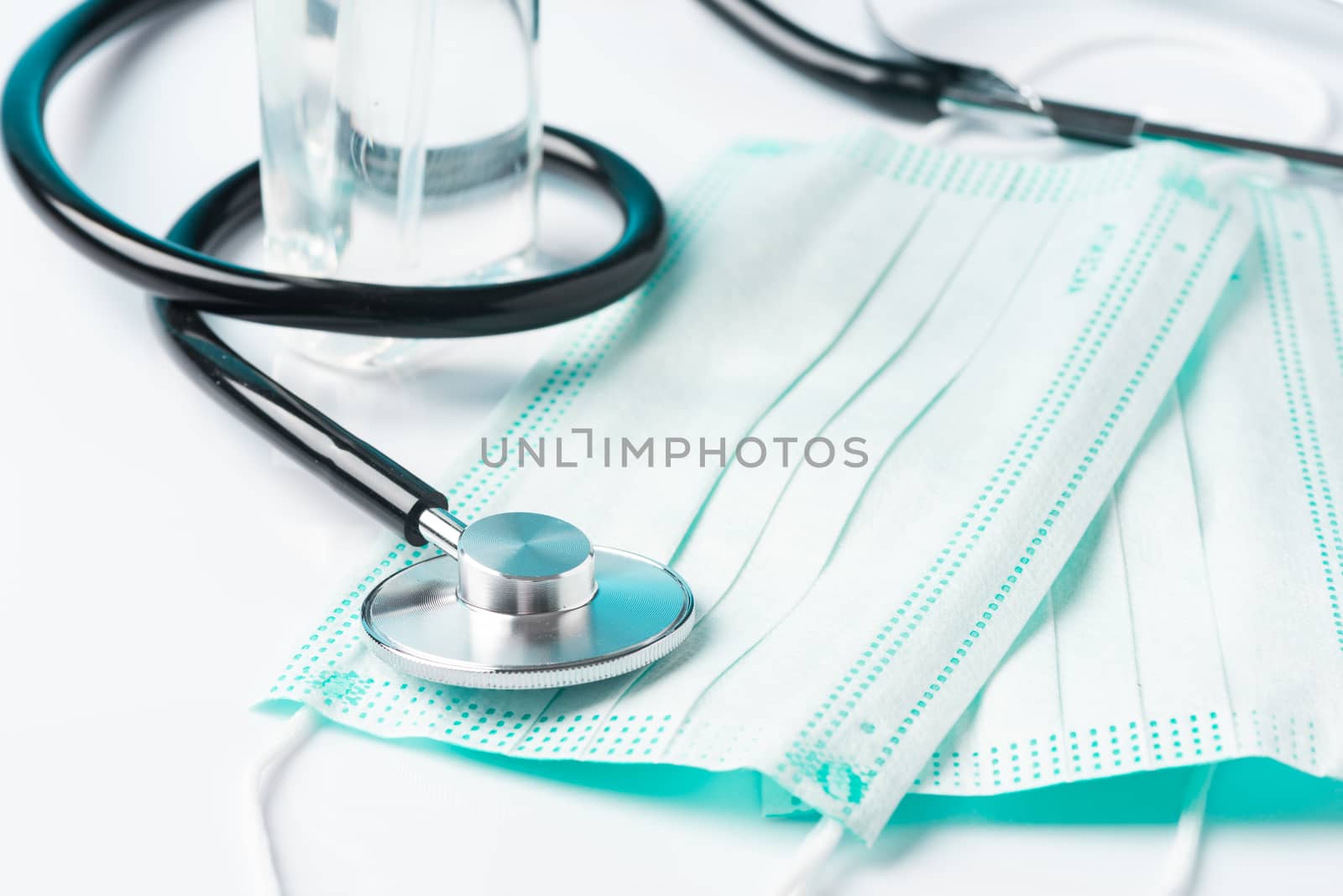 Coronavirus Pandemic Outbreak Related Items. Surgical Mask and Hand Sanitizer Gel, Doctor Stethoscope.