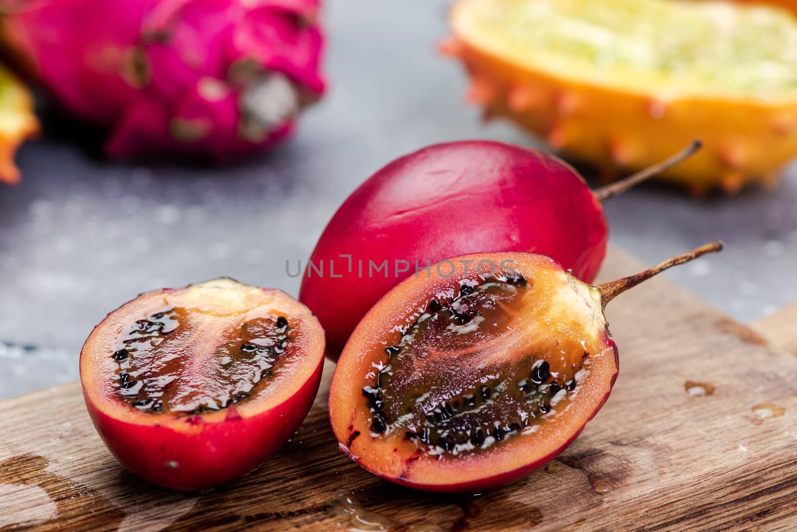 Tamarillo or Tree Tomato Exotic Fruit. Whole and Cut Tamarillo Fruit.