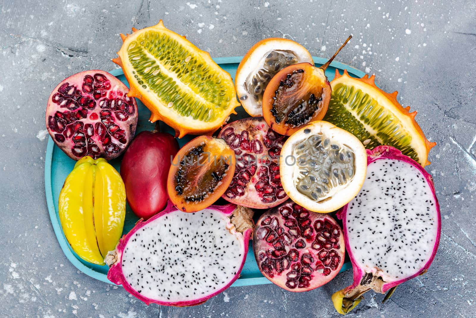 Tropical Exotic Fruits on Concrete Background, Top Down view.