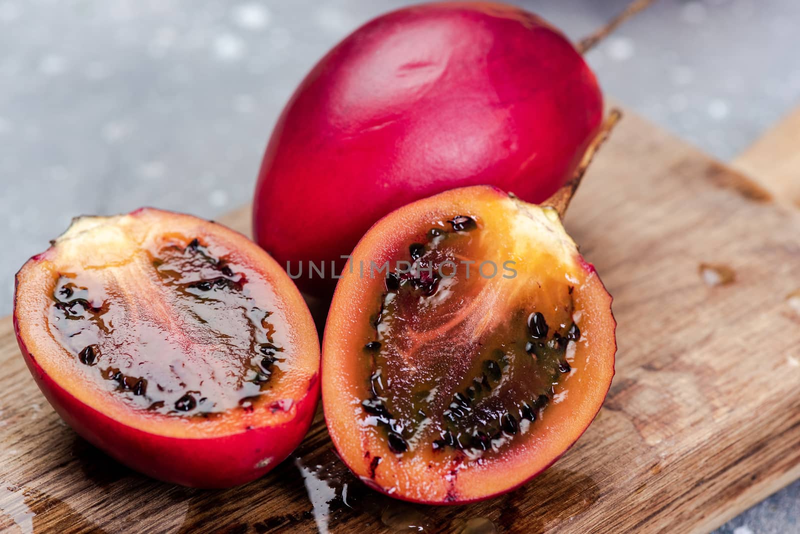 Tamarillo or Tree Tomato Exotic Fruit. Whole and Cut Tamarillo F by merc67
