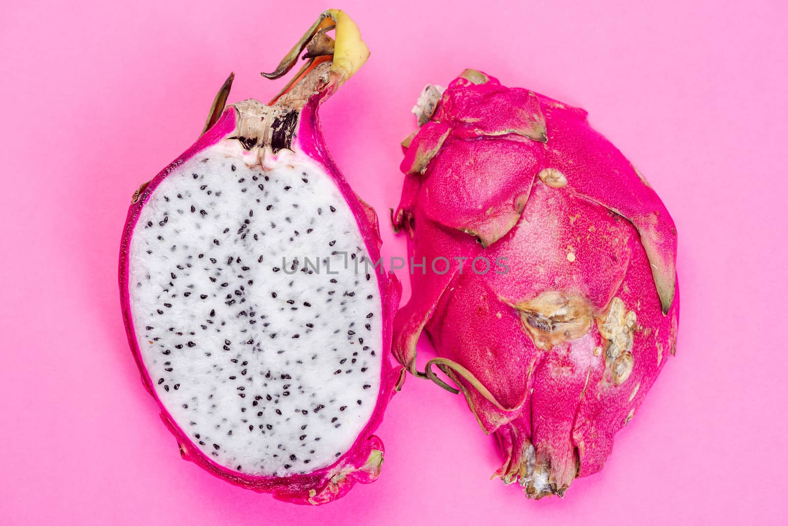 Pitahaya or Dragon Fruit Cut in Half on Pink Pastel Background.  by merc67