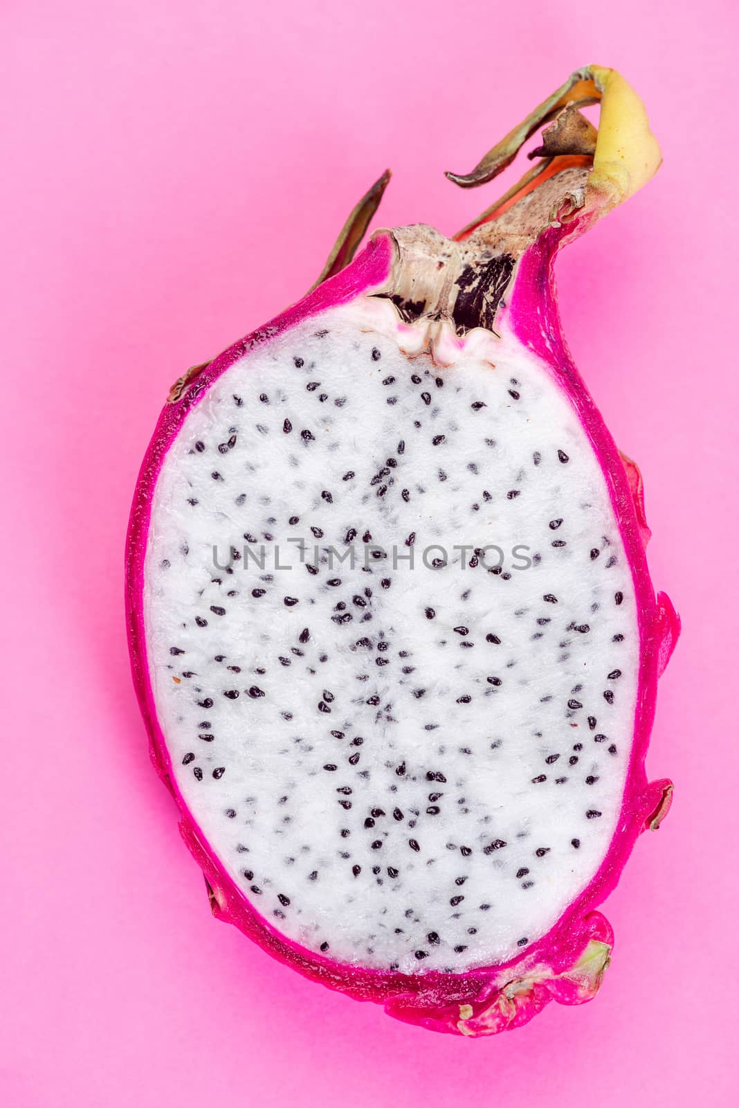 Pitahaya or Dragon Fruit Cut in Half on Pink Pastel Background. Flat Lay. Healthy Exotic Fruits.