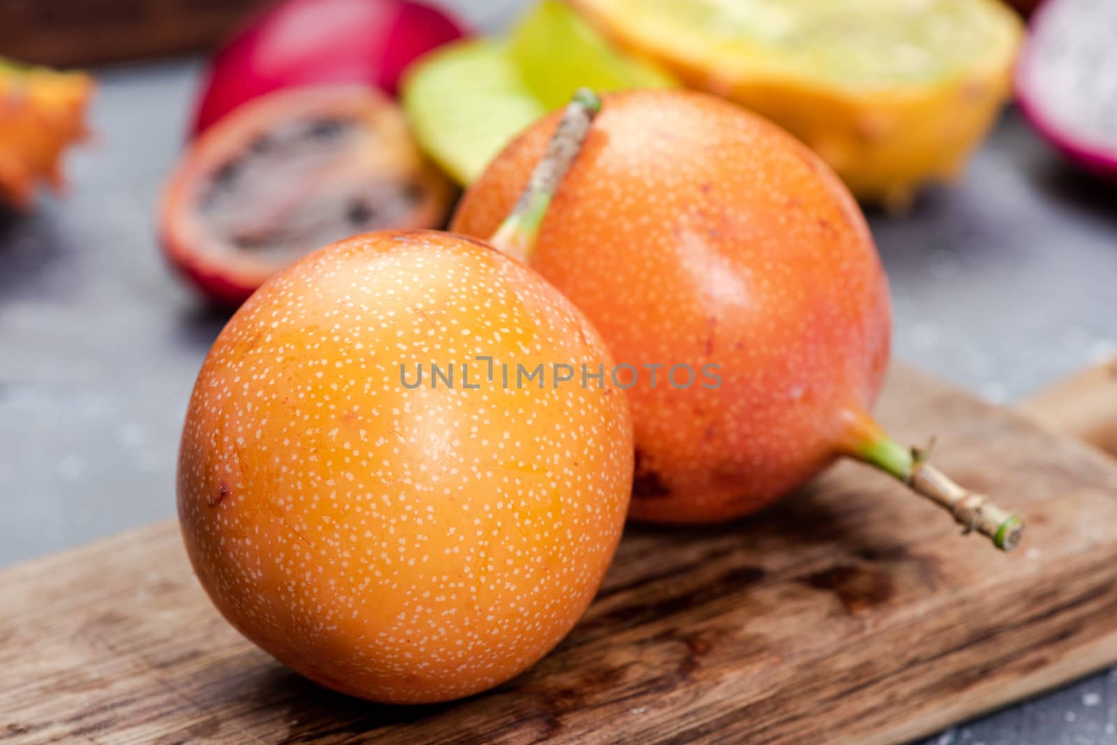 Granadilla or Grenadia Passionfruit Whole EXotic Fruits on Woode by merc67