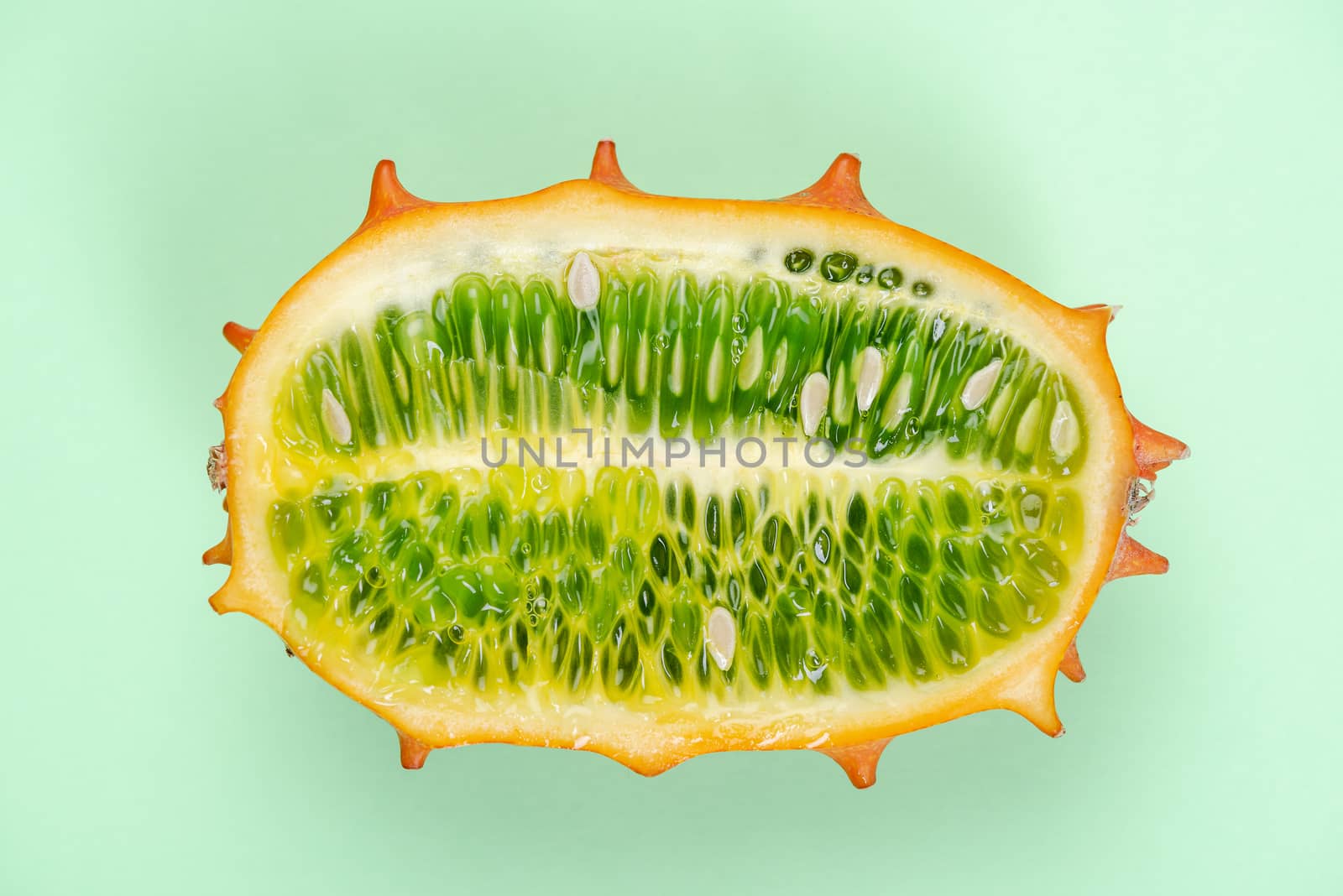 Kiwano or Horned Melon Fruit Cut in Half. Exotic Fruit. Detail Close Up. Pastel Background.