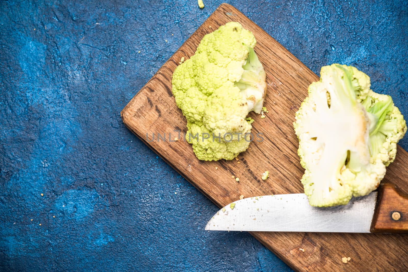 Green Cauliflower Cabbage on Cutting Board. Market Fresh Organic by merc67