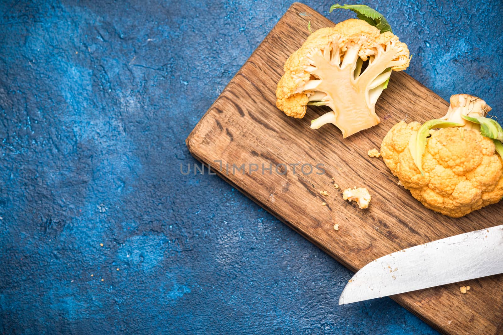 Yellow Cauliflower Cabbage on Cutting Board. Market Fresh Organi by merc67