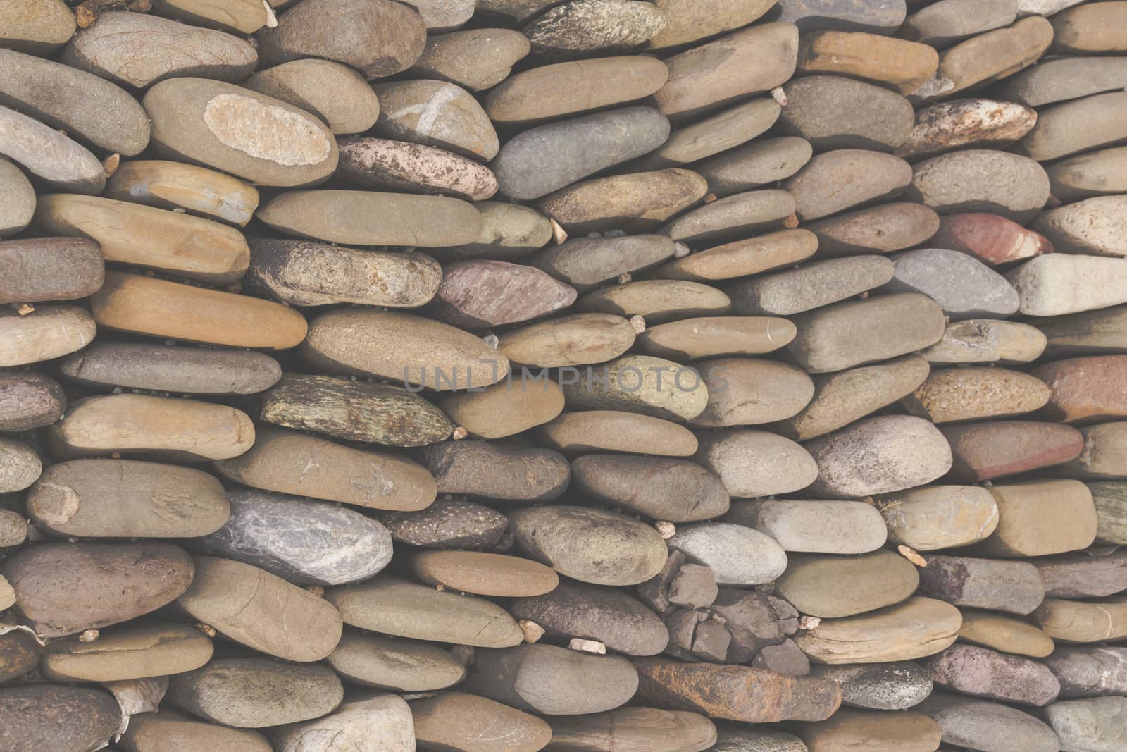 Photograph of a rounded river rocks background