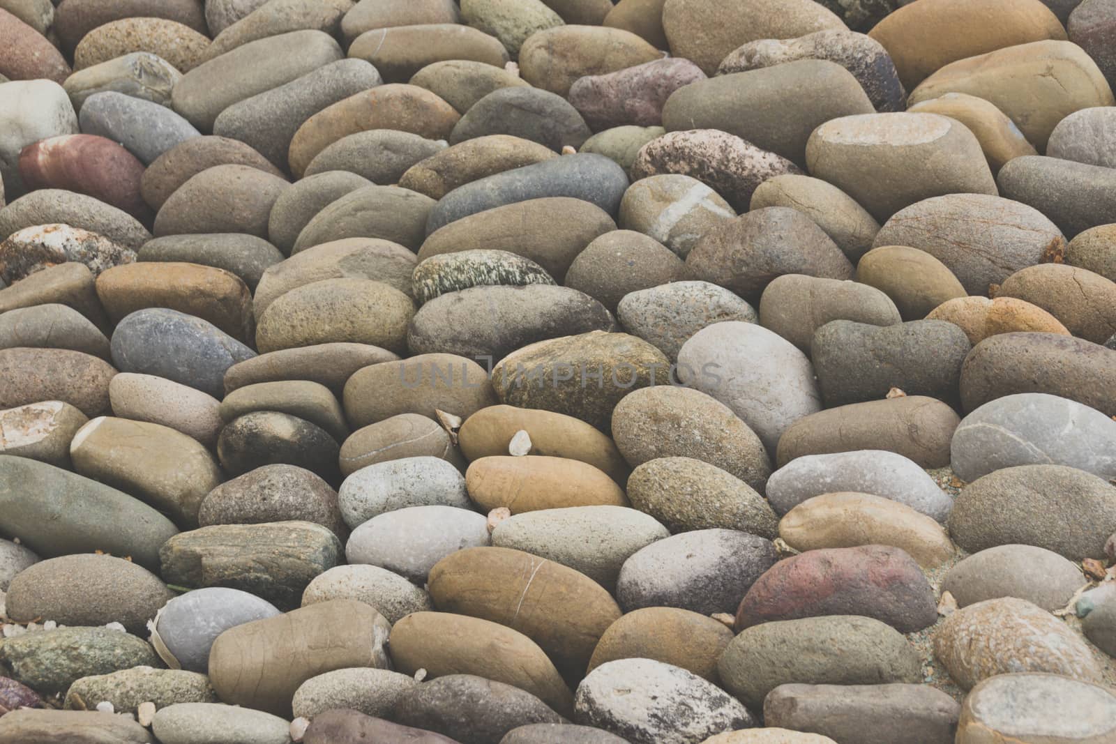 Photograph of a rounded river rocks background