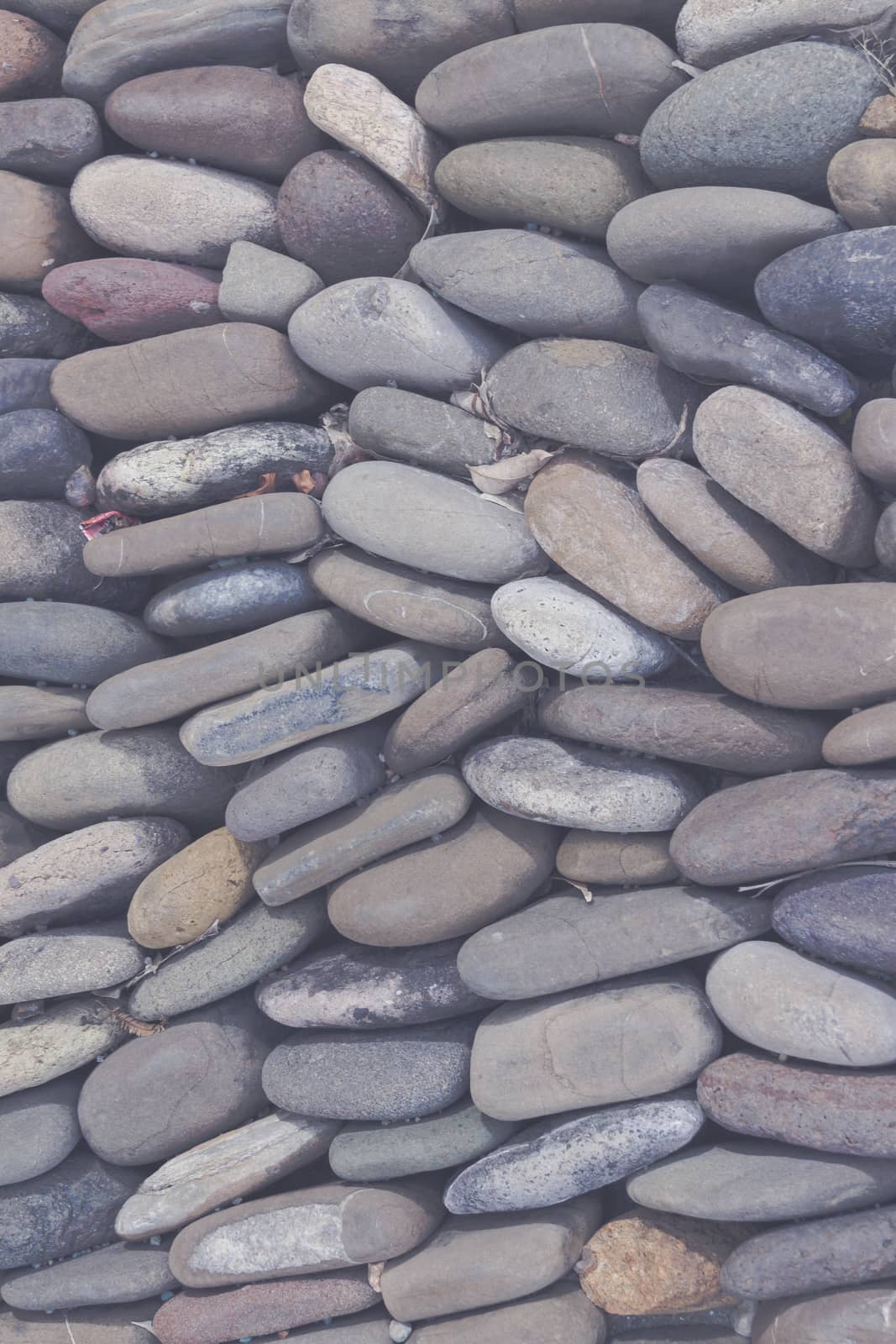 Photograph of a rounded river rocks background