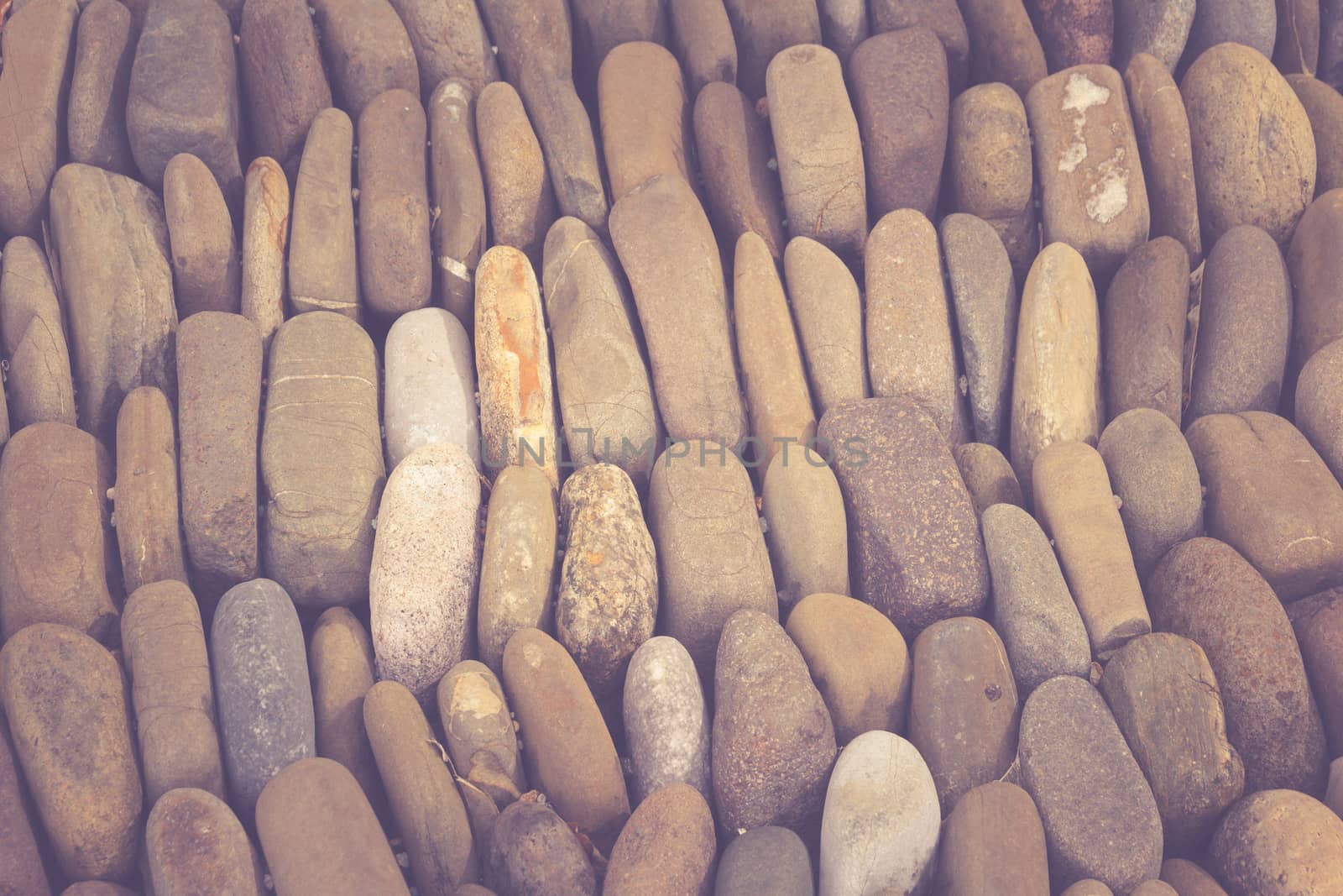 Photograph of a rounded river rocks background