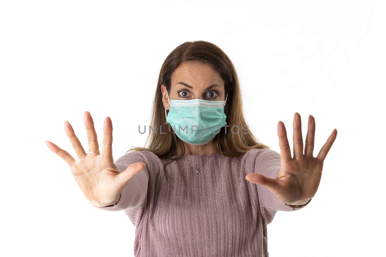 scared woman with a mask on white