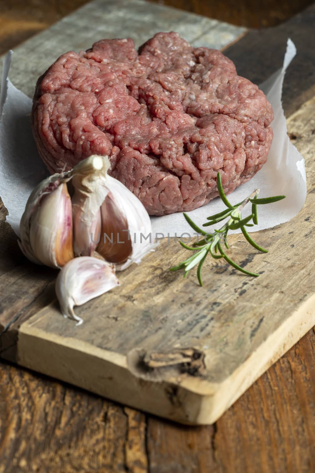 raw minced meat on dark wood