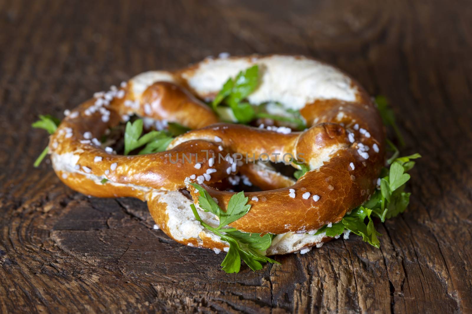 bavarian pretzel with butter and parsley
