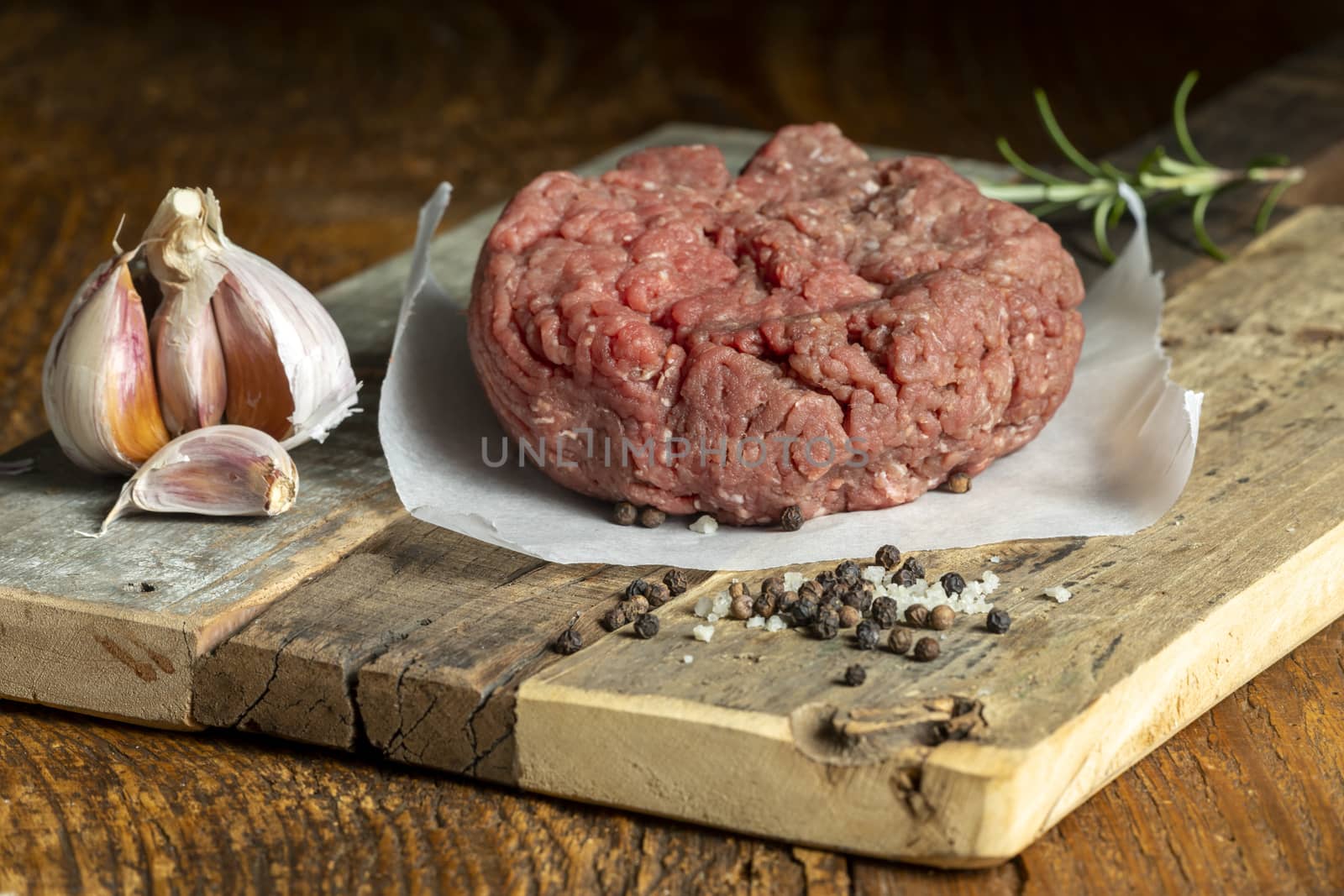 raw minced meat on dark wood