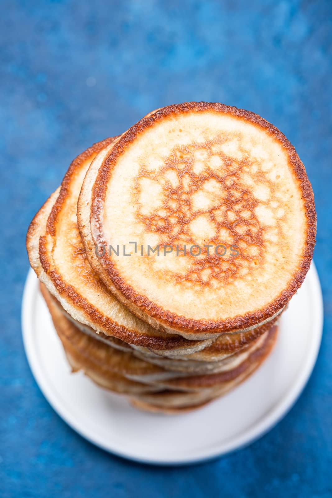 Stack of Pancakes on Plate. Overhead Close Up View.