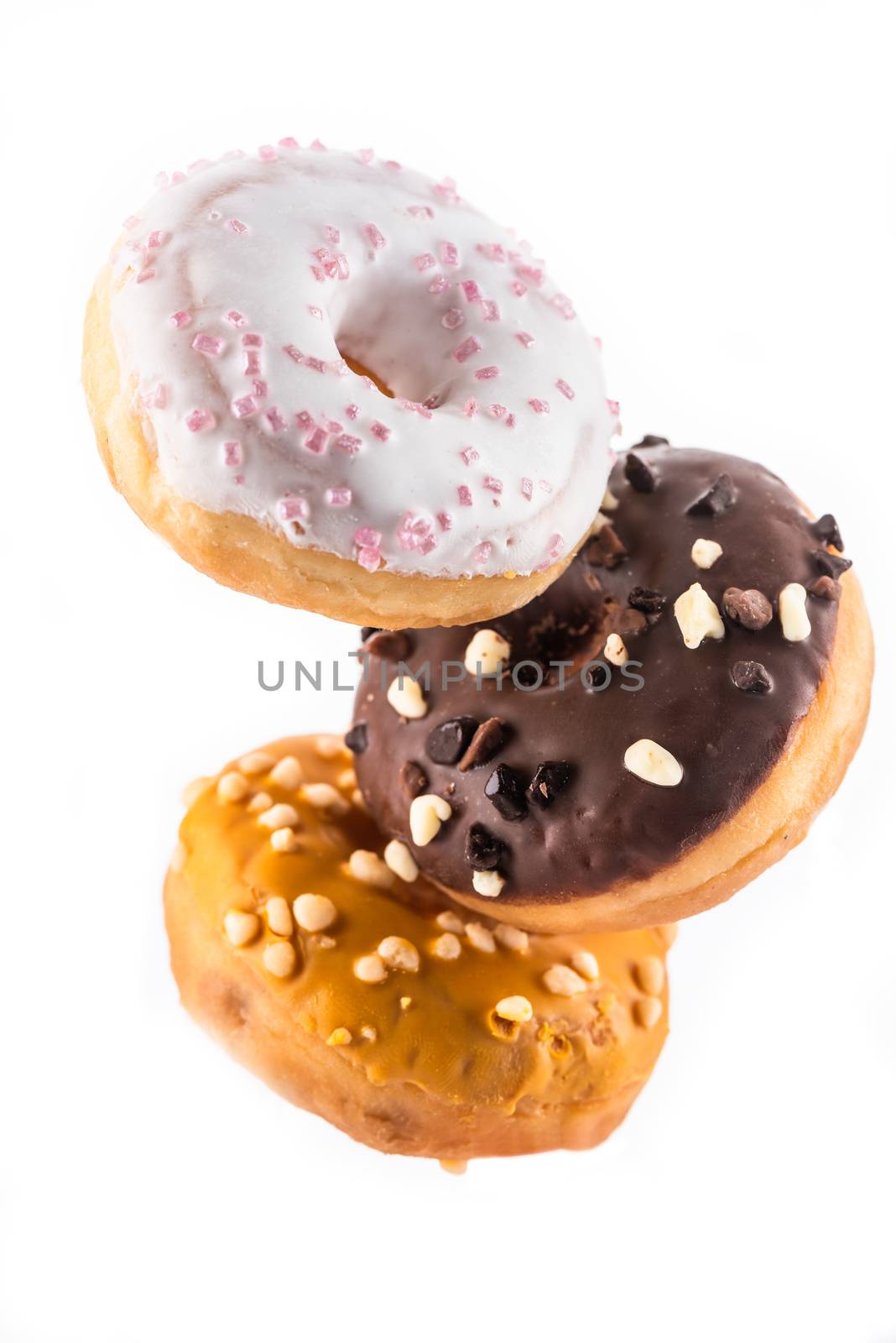 Flying Donut or Doughnut Creative Image. Falling Food On White Background. Food in Motion.