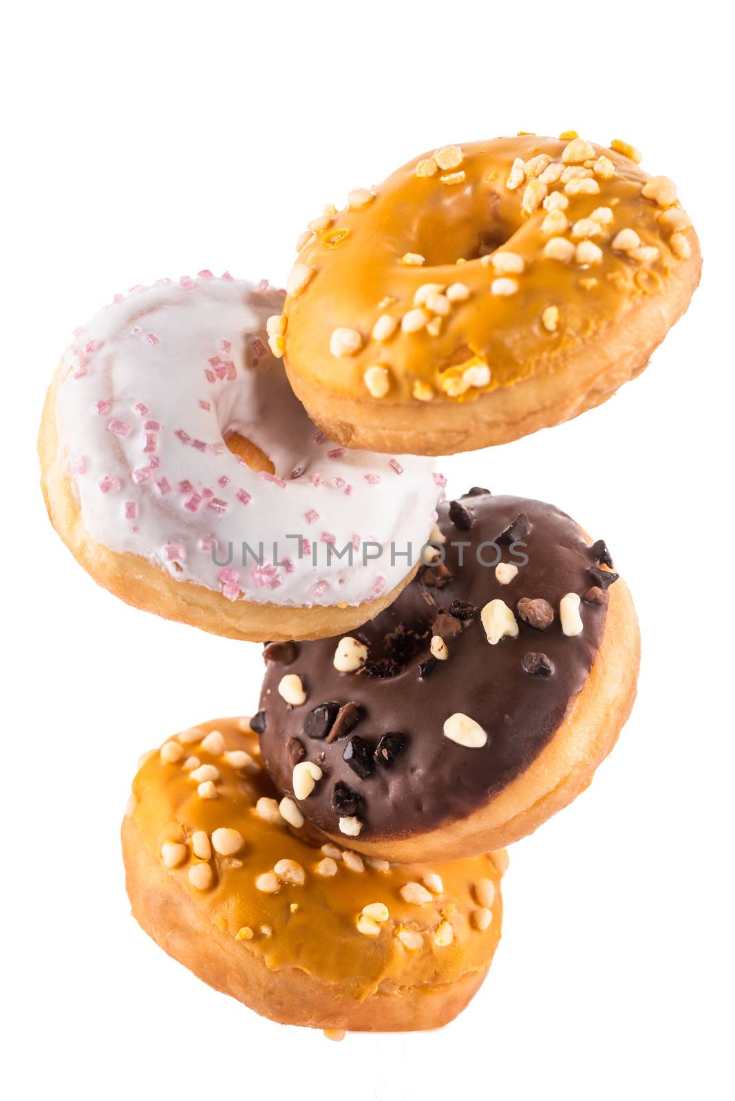 Flying Donut or Doughnut Creative Image. Falling Food On White Background. Food in Motion.