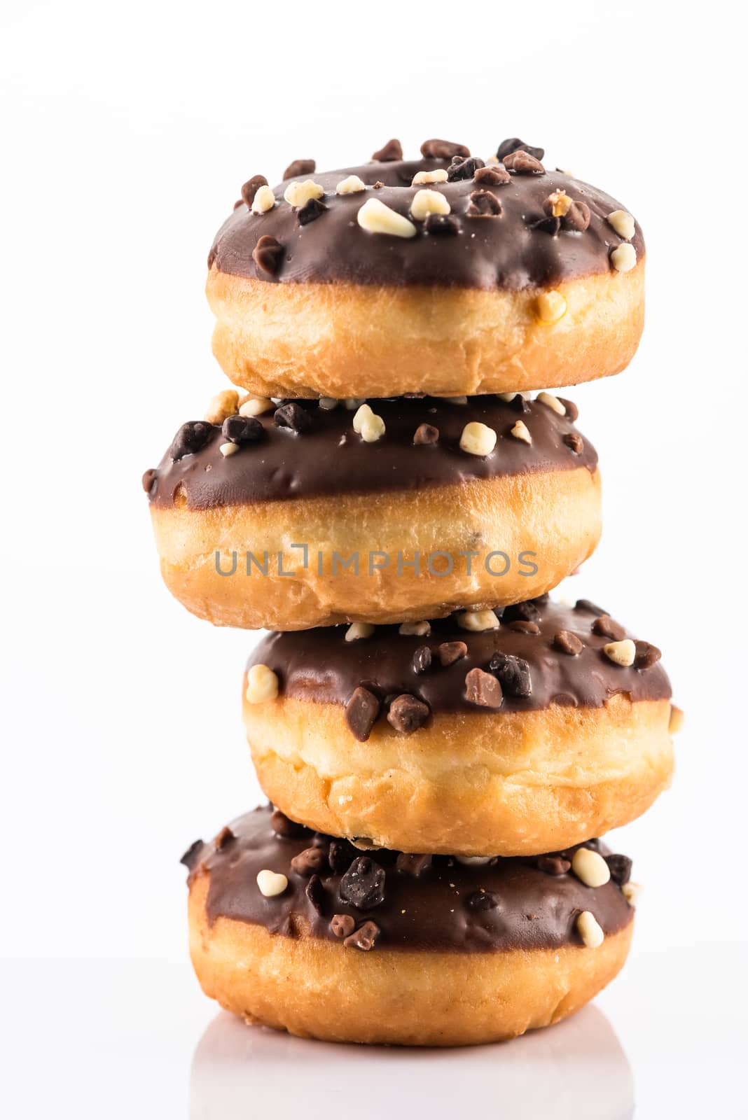 Chocolate and Peanuts Donut or Dougnut Tower on White Background by merc67