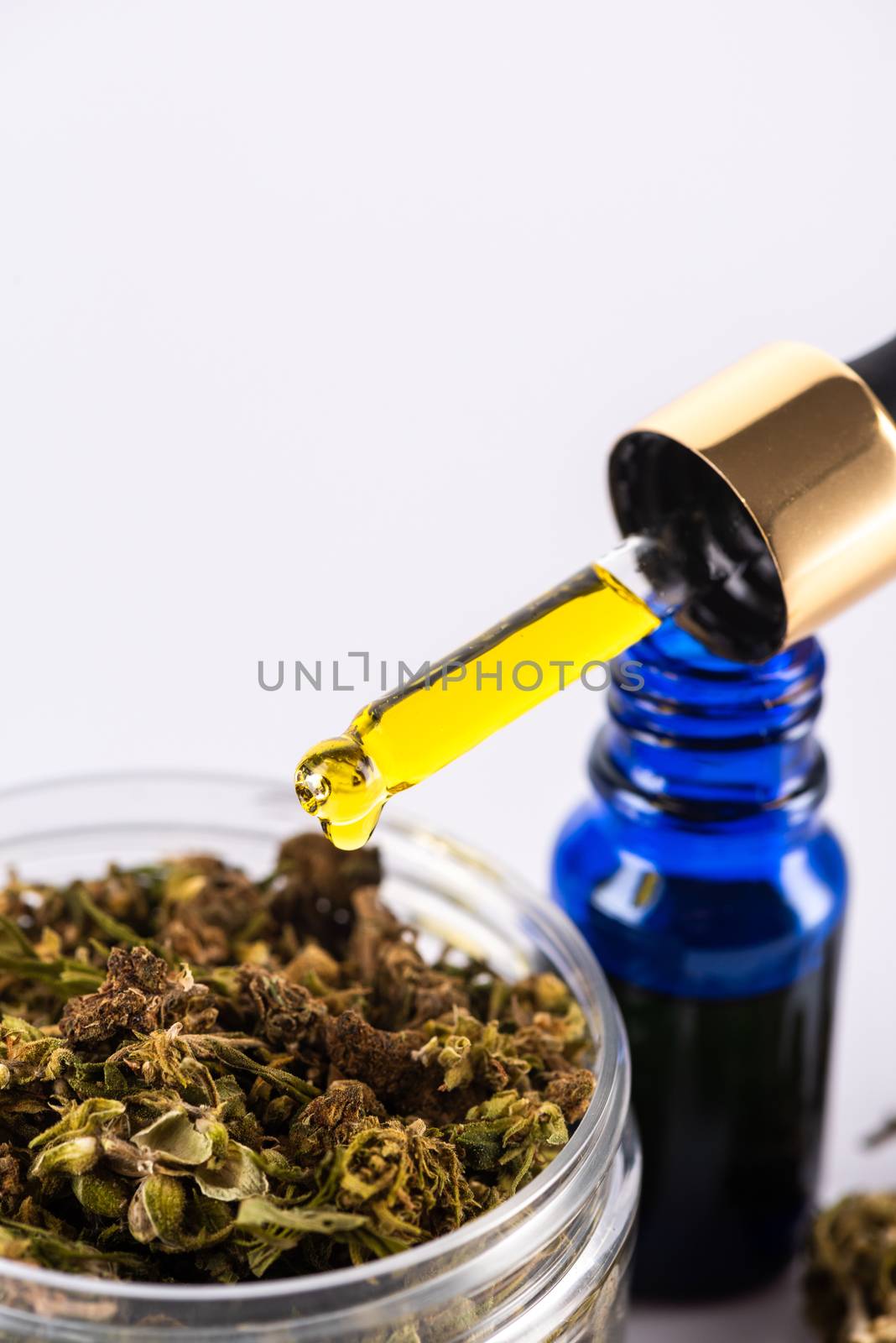 Droplet with CBD Cannabidiol Oil. Medical Marijuana and Cannabis Use Concept.