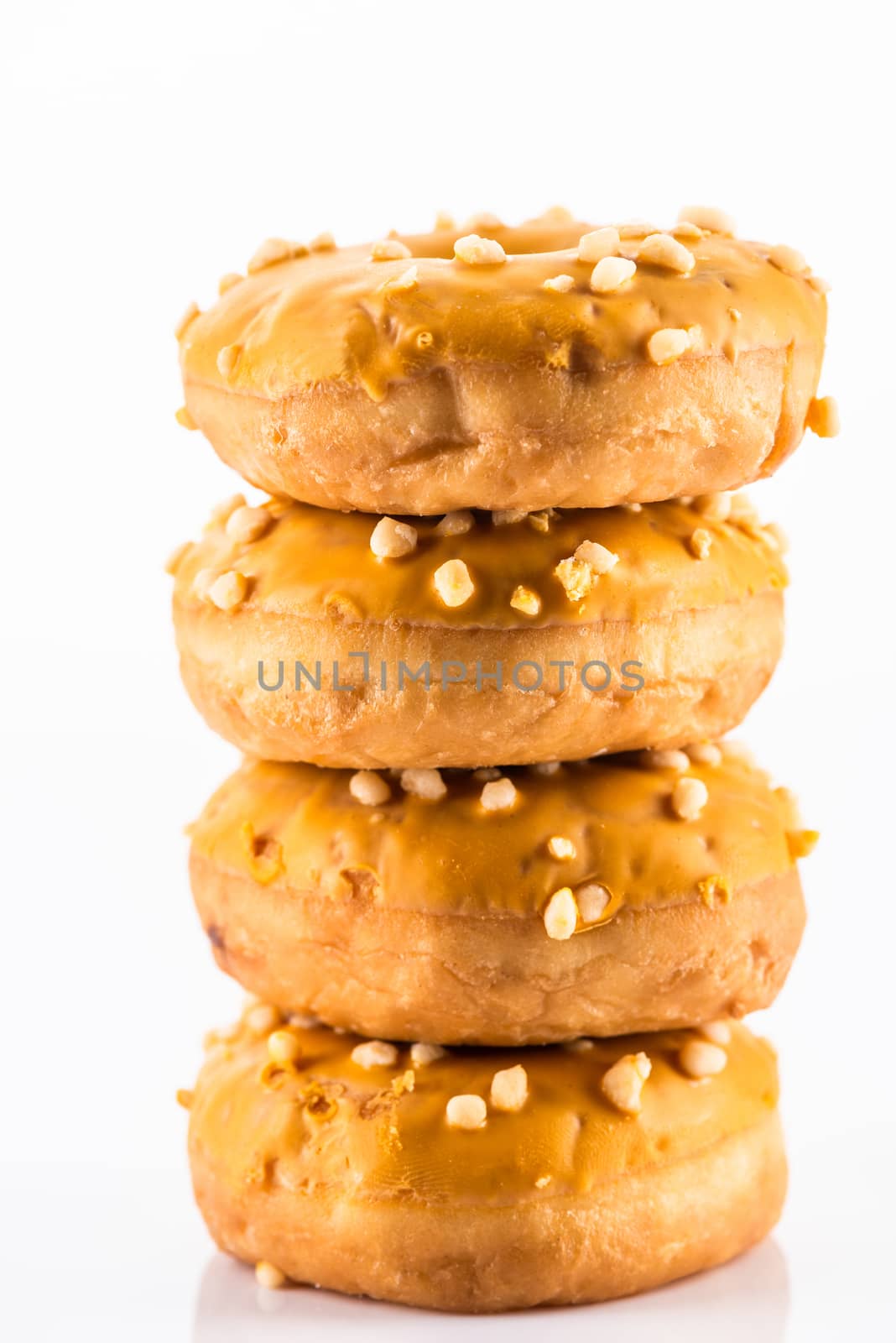 Salted Caramel Donut or Dougnut Tower on White Background by merc67