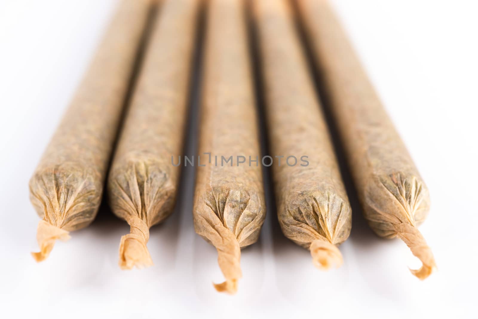Medical Cannabis Marijuana Joints on White Background, Close Up View.