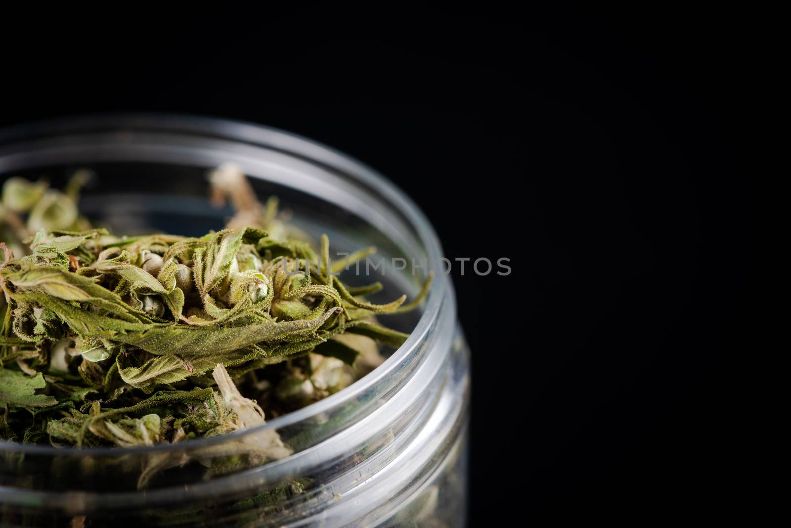 Sativa Indica or Cannabis Marijuana Flower Buds in Glass Jar. re by merc67