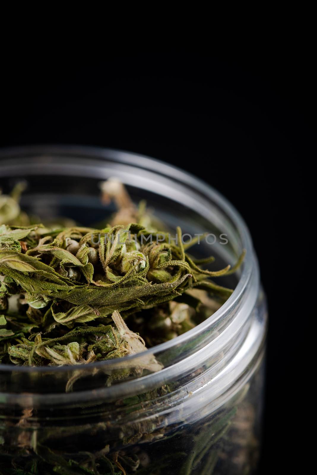 Sativa Indica or Cannabis Marijuana Flower Buds in Glass Jar. re by merc67