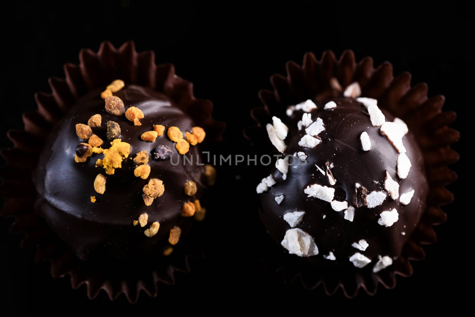 Chocolate Pralines Decorated by Hand. Close Up View on Details.