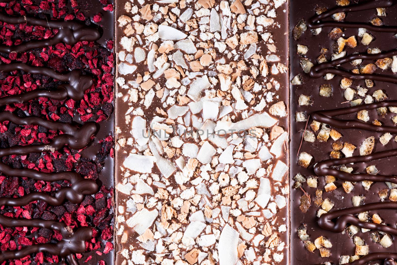 Chocolate Bars Topped with Freeze - Dried Fruits. Top Down Closeup View.