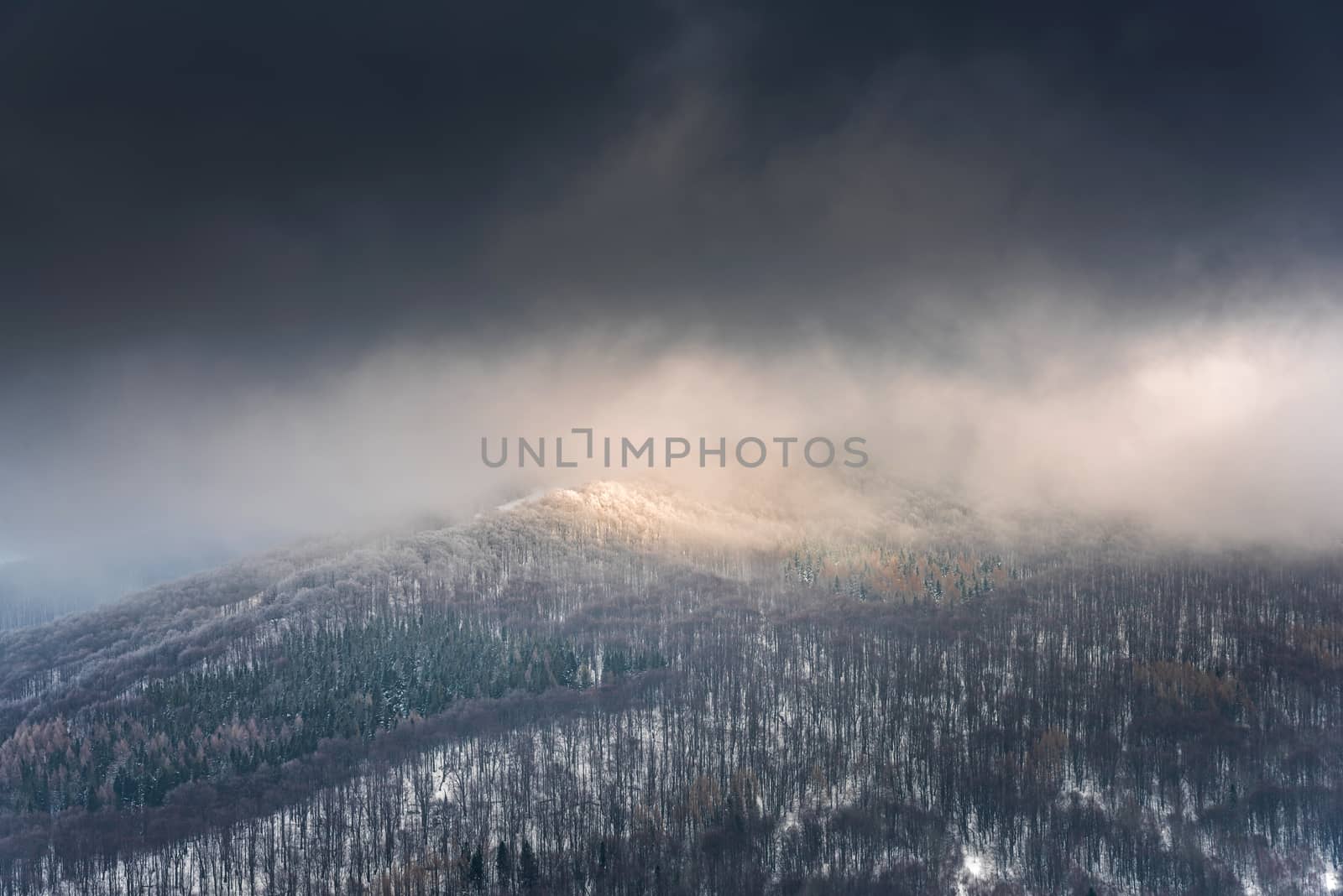 Dramatic and Moody Image of Weather in Mountains at Winter Time.