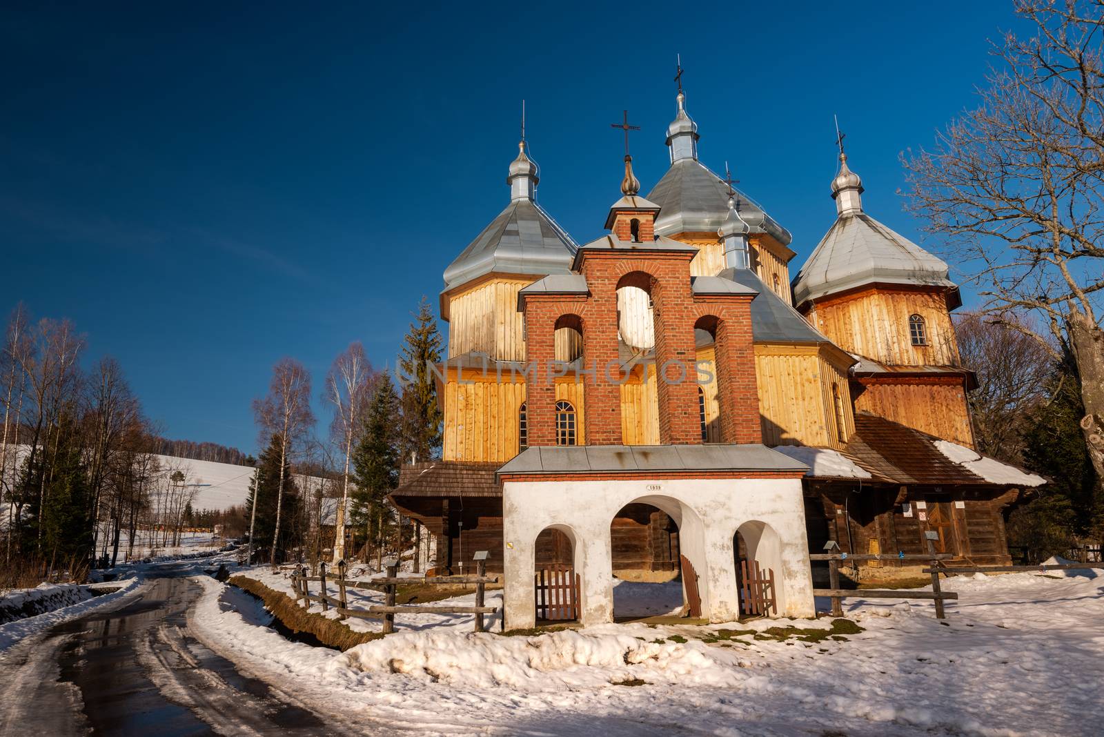 Wooden Orthodox Church in Bystre. Carpathian Mountains and Bieszczady Architecture in Winter.