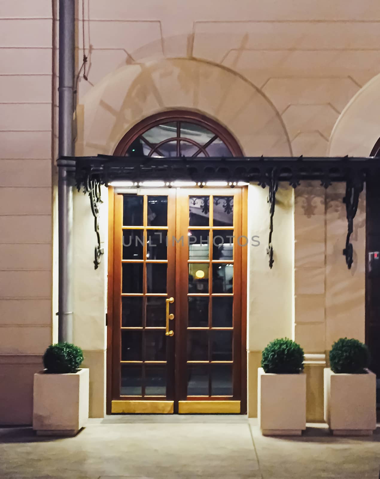 Exterior facade of classic building in the European city at night, architecture and design by Anneleven