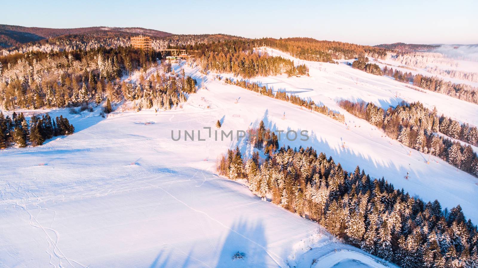 Tree Top Observation Tower in Slotwiny near Krynica in Poland at Winter Season. Aerial Drone view.