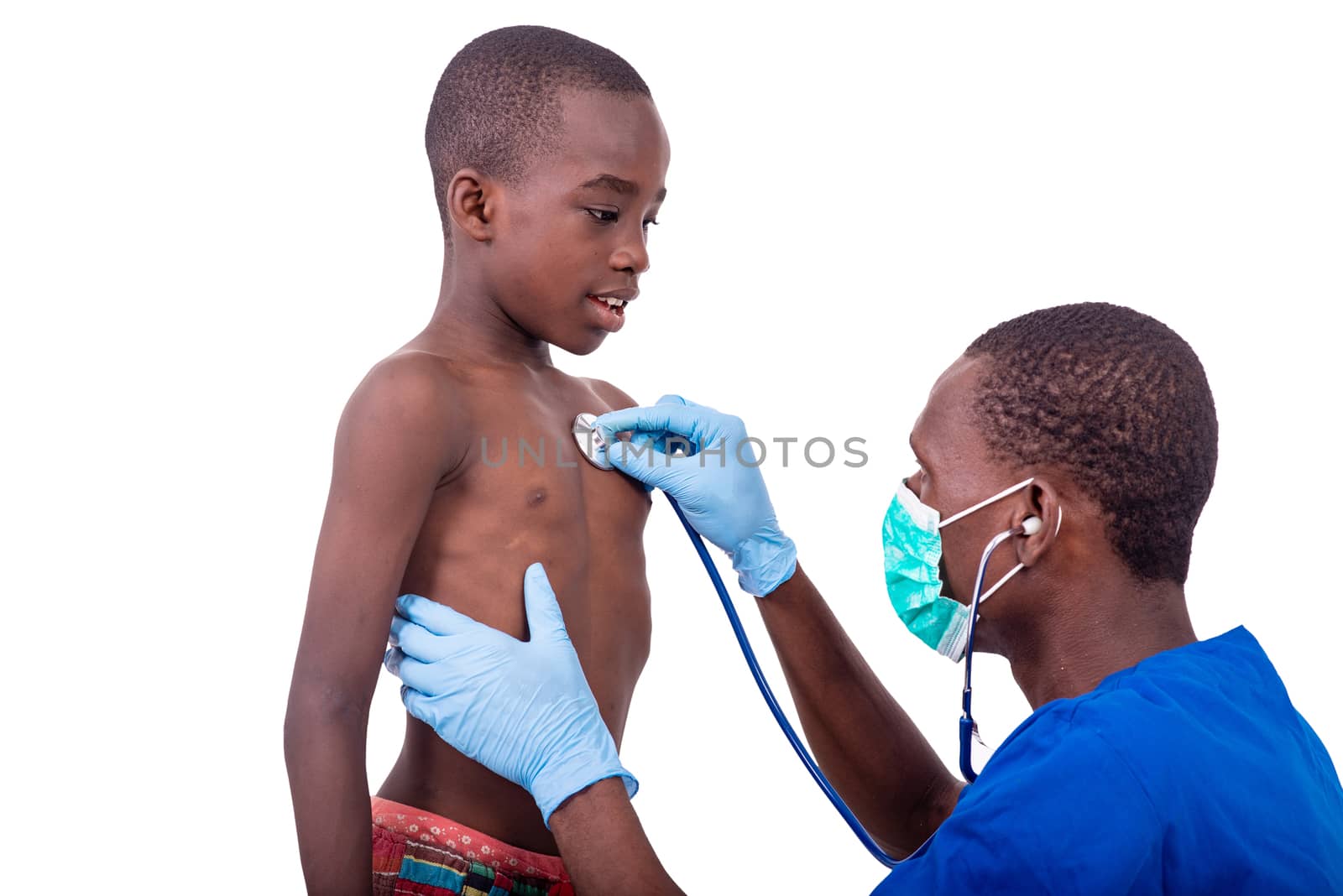 young male doctor in uniform examining little boy with stethoscope in hospital.
