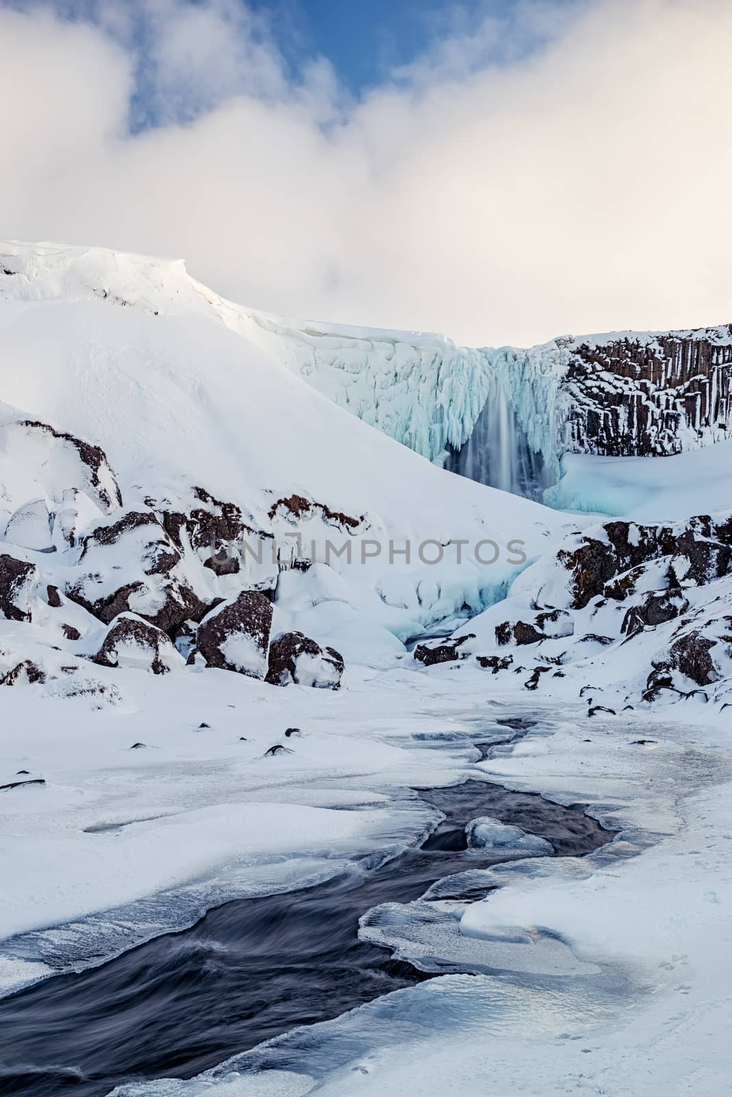 Iced Svodufoss waterfall in Snaefellsnes peninsula, Iceland