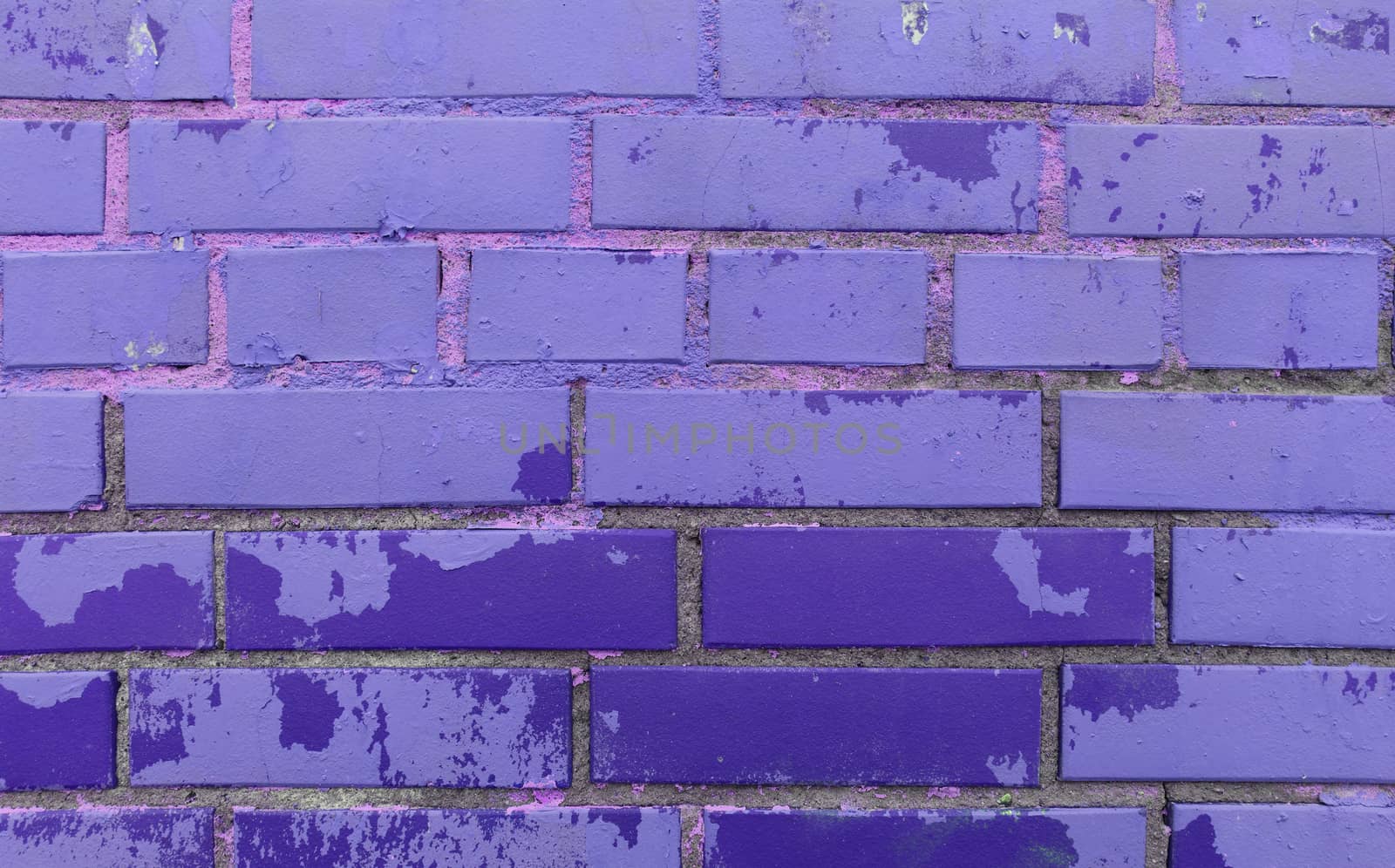 Colored bricks wall texture. Painted blocks urban street texture.