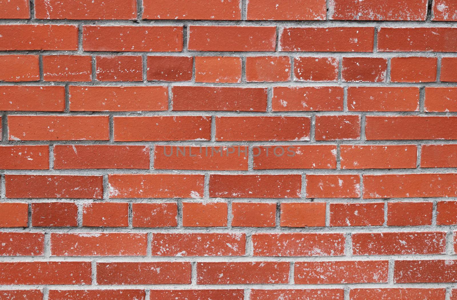 Cement stains red bricks wall texture.