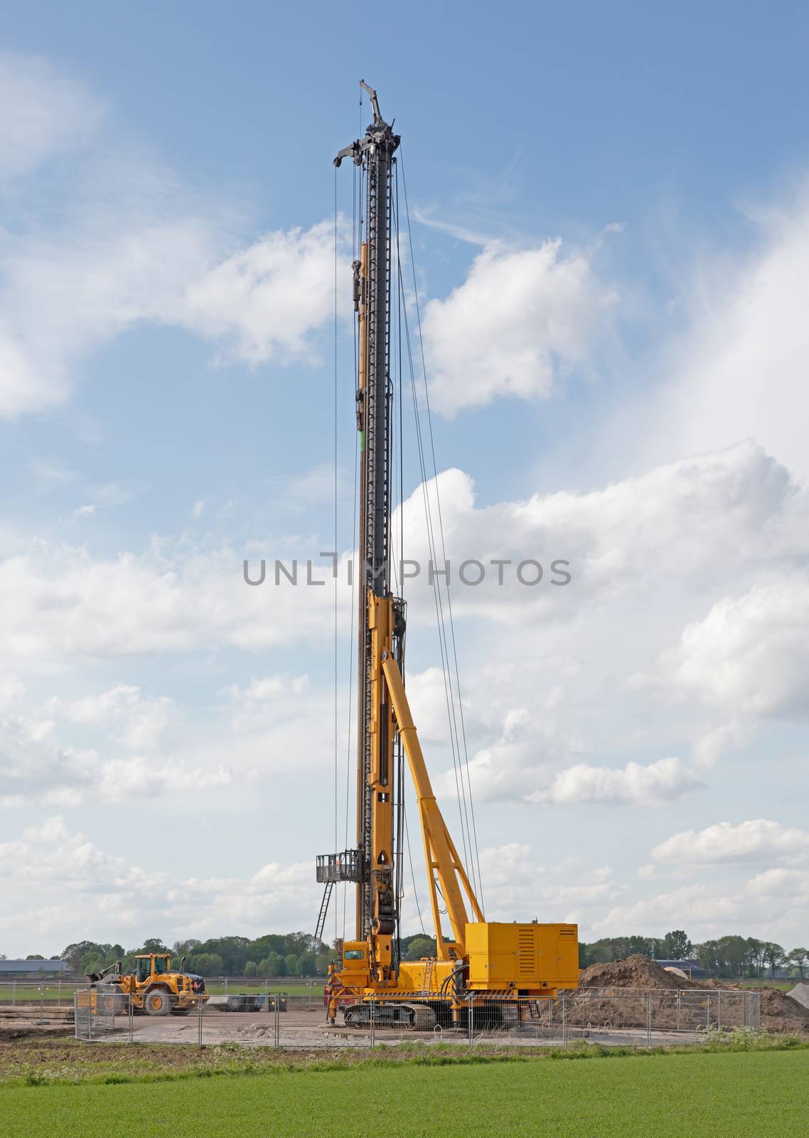 Foundation drill machine in the dutch flat landscape