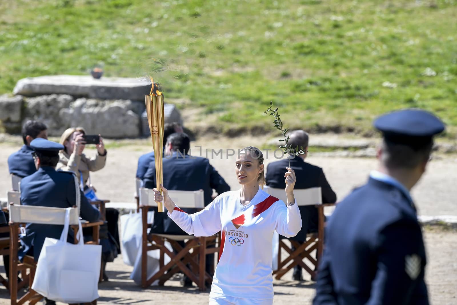 Olympia, Greece -  March 12, 2020: Olympic Flame handover ceremony for the Tokyo 2020 Summer Olympic Games at the Ancient Olympia site, birthplace of the ancient Olympics in southern Greece.