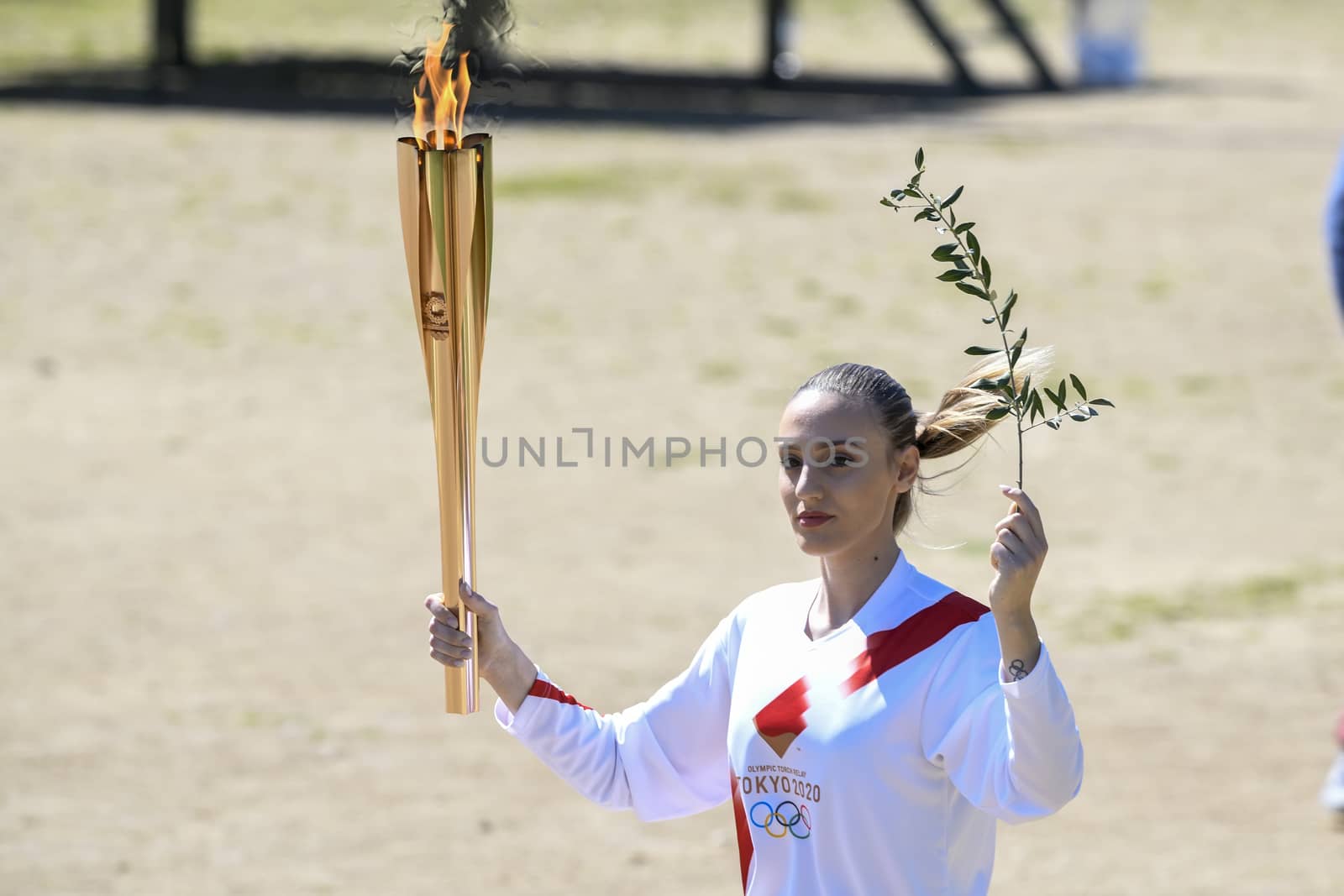 Olympia, Greece -  March 12, 2020: Olympic Flame handover ceremony for the Tokyo 2020 Summer Olympic Games at the Ancient Olympia site, birthplace of the ancient Olympics in southern Greece.