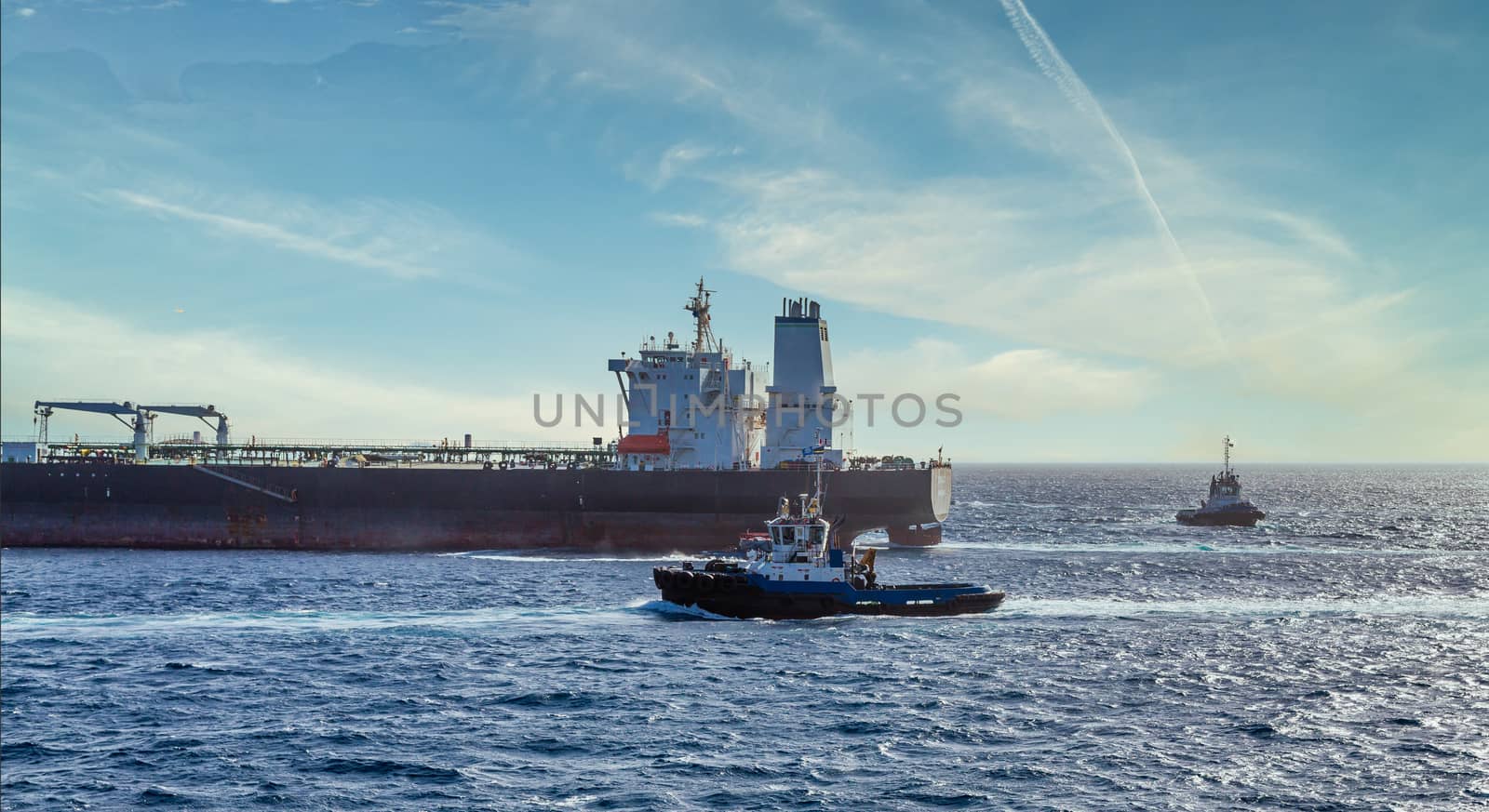 A blue tugboat working the waters of Curacao