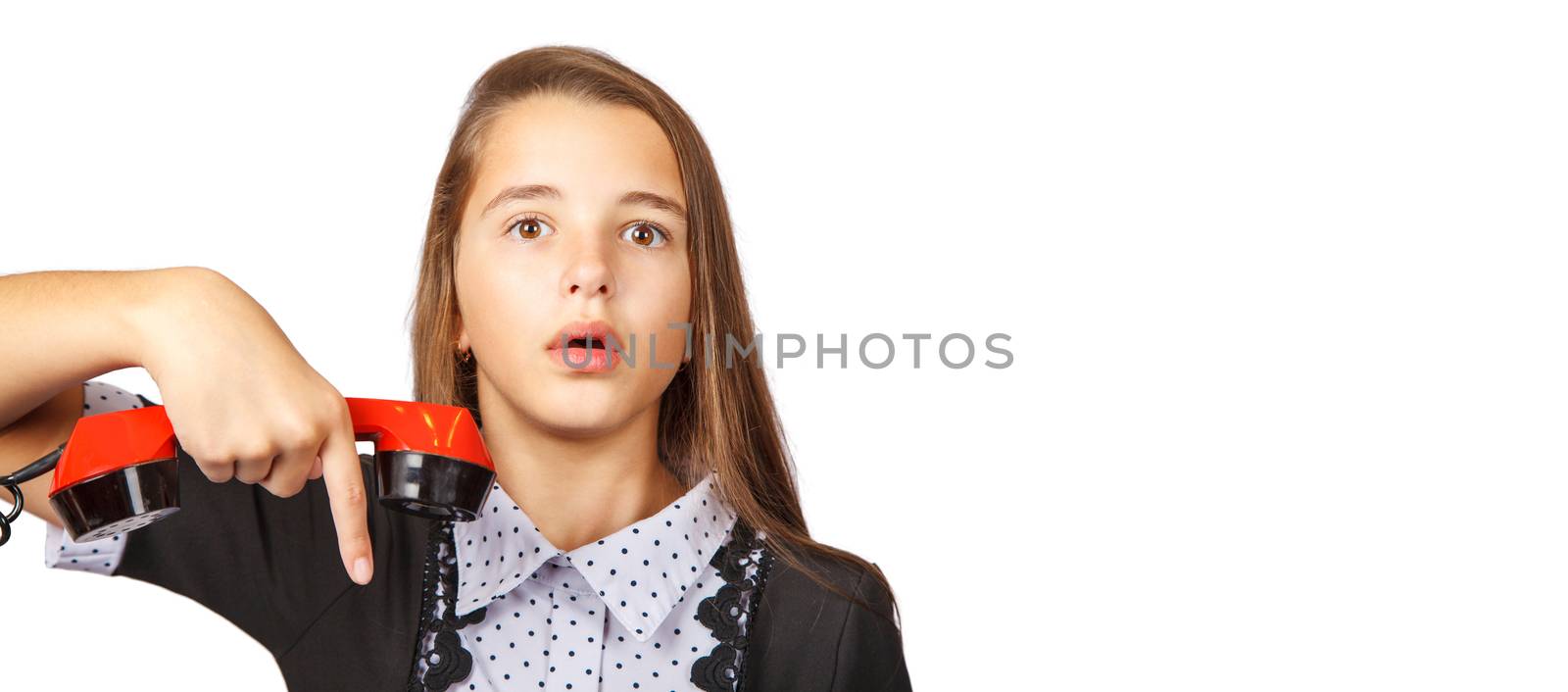 teenage girl talking on red retro telephone closeup on white background
