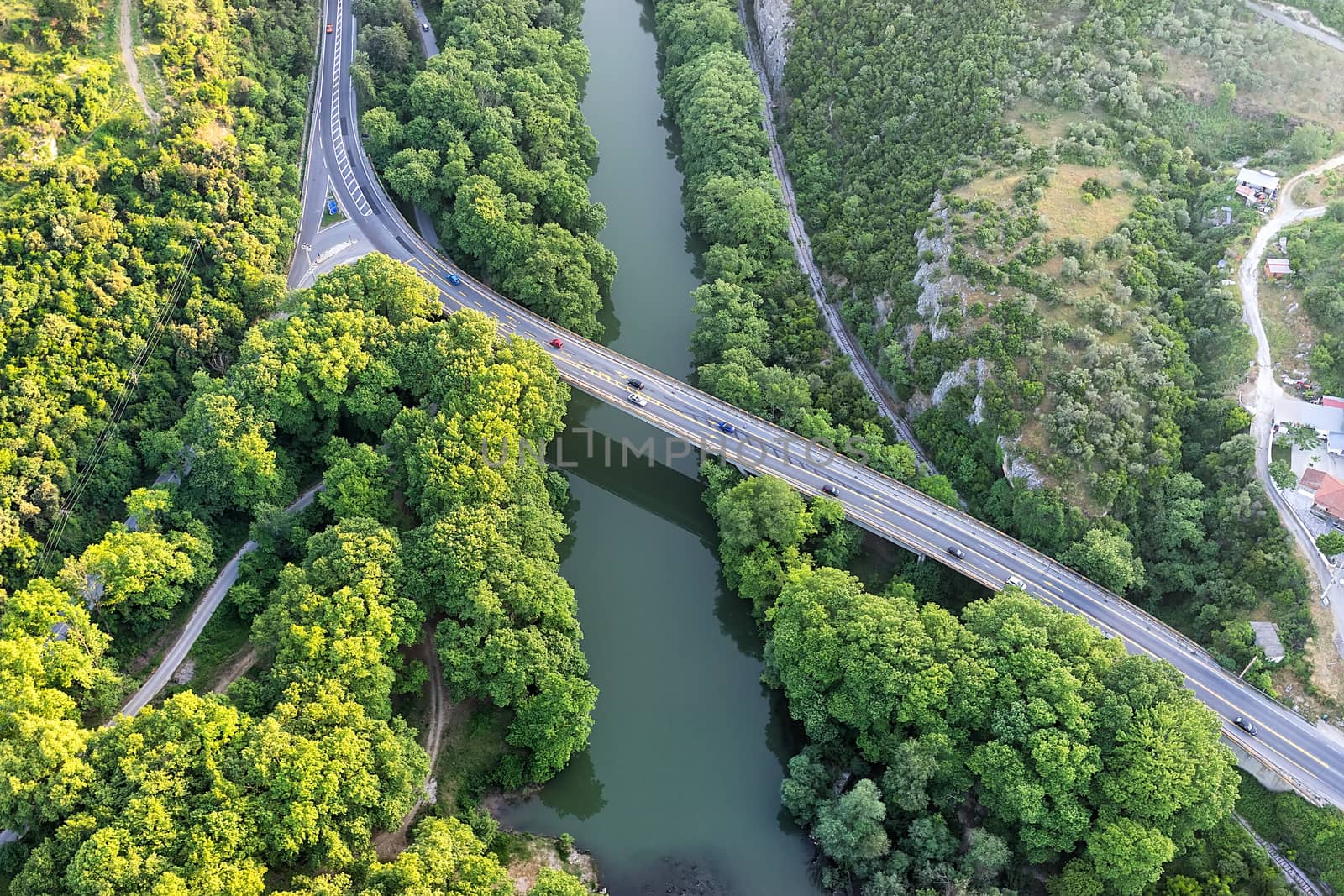 Aerial view of the bridge and the road over the river Pinios in  by ververidis