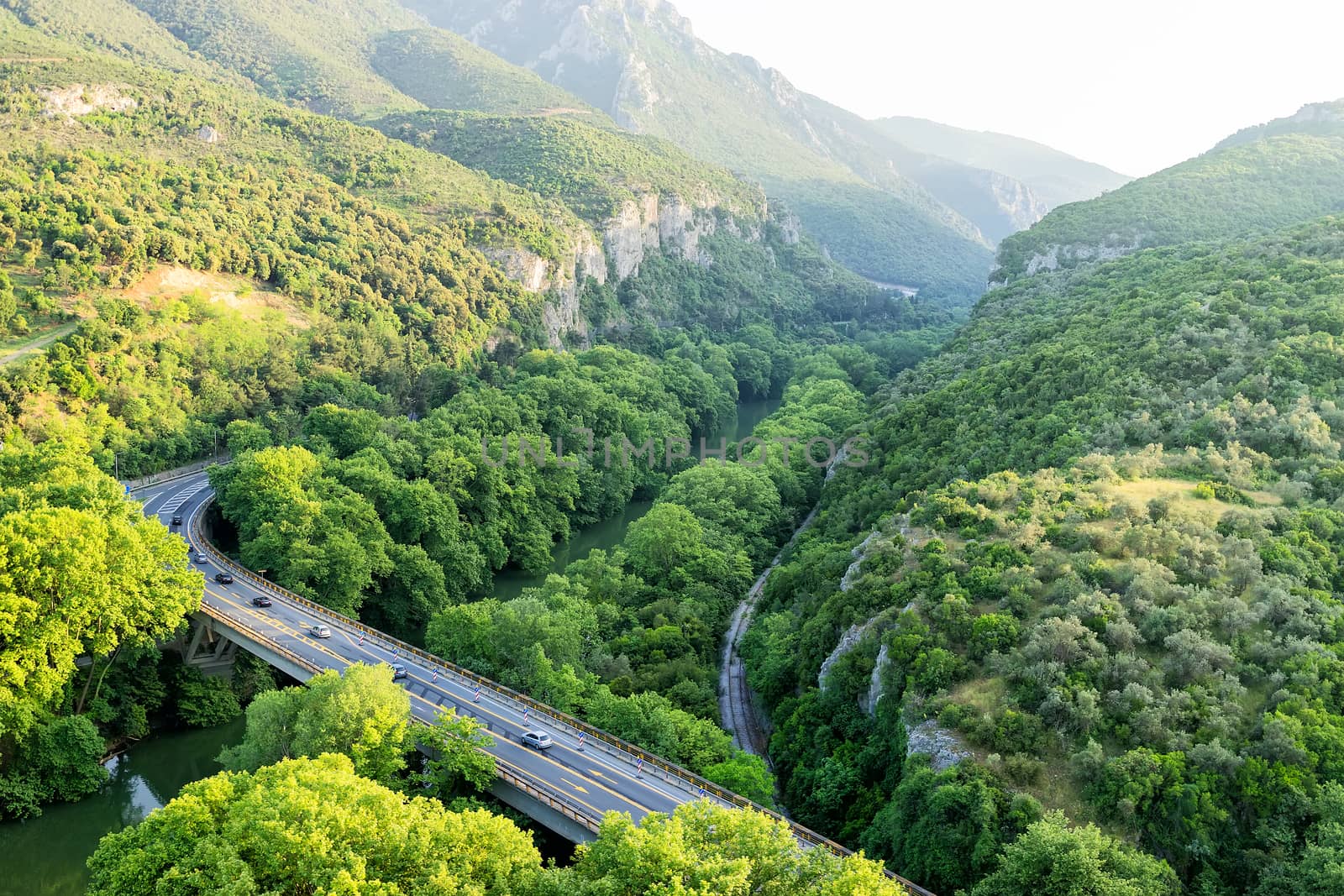 Aerial view of the bridge and the road over the river Pinios in  by ververidis