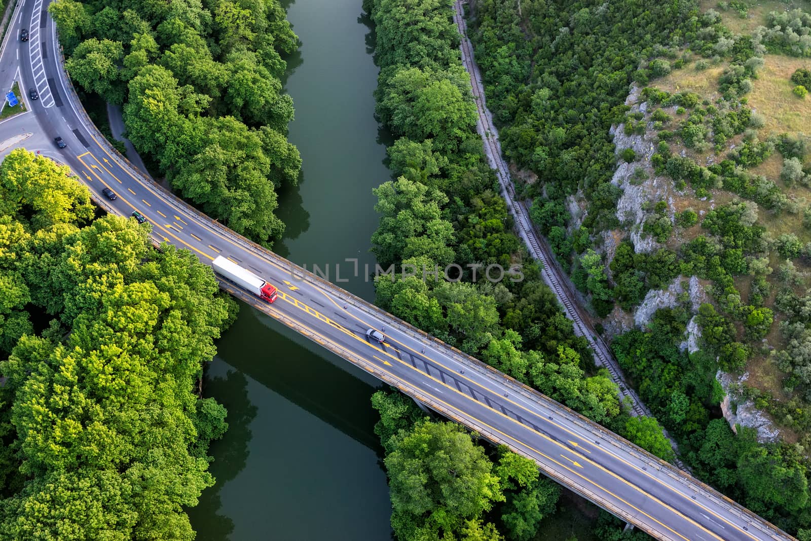 Aerial view of the bridge and the road over the river Pinios in  by ververidis