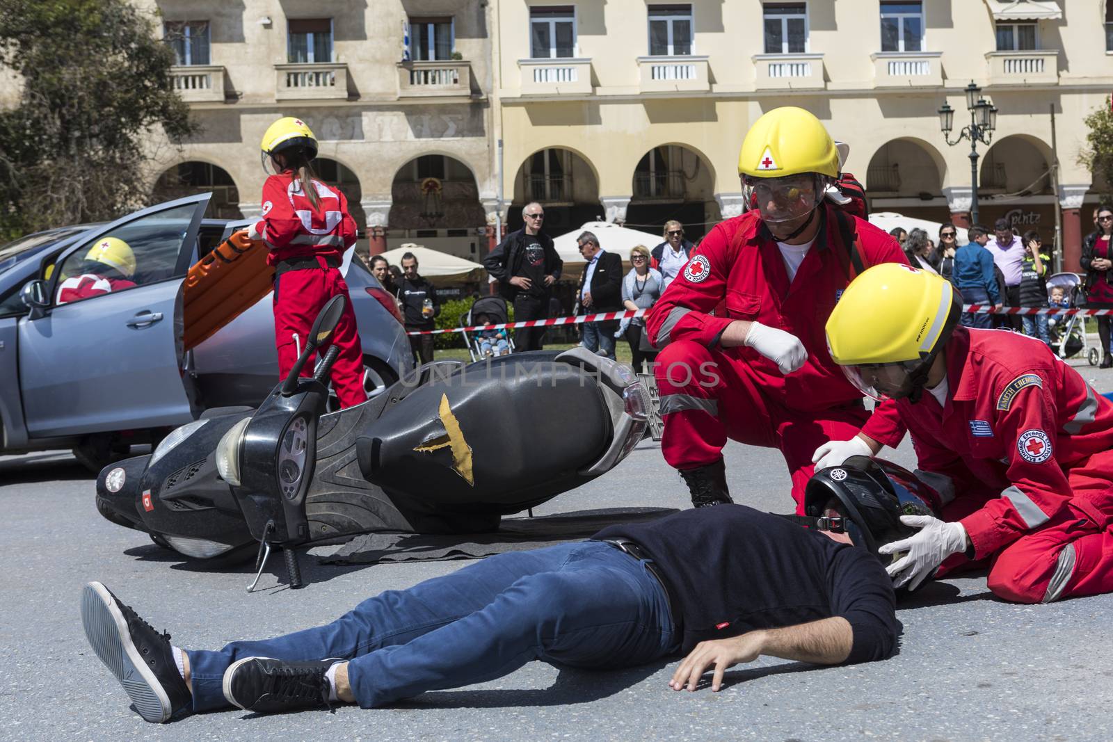 Thessaloniki , Greece - April 9, 2017: First aid, victim liberation in an car accident and helmet removal demonstration by the Hellenic Red Cross rescue team