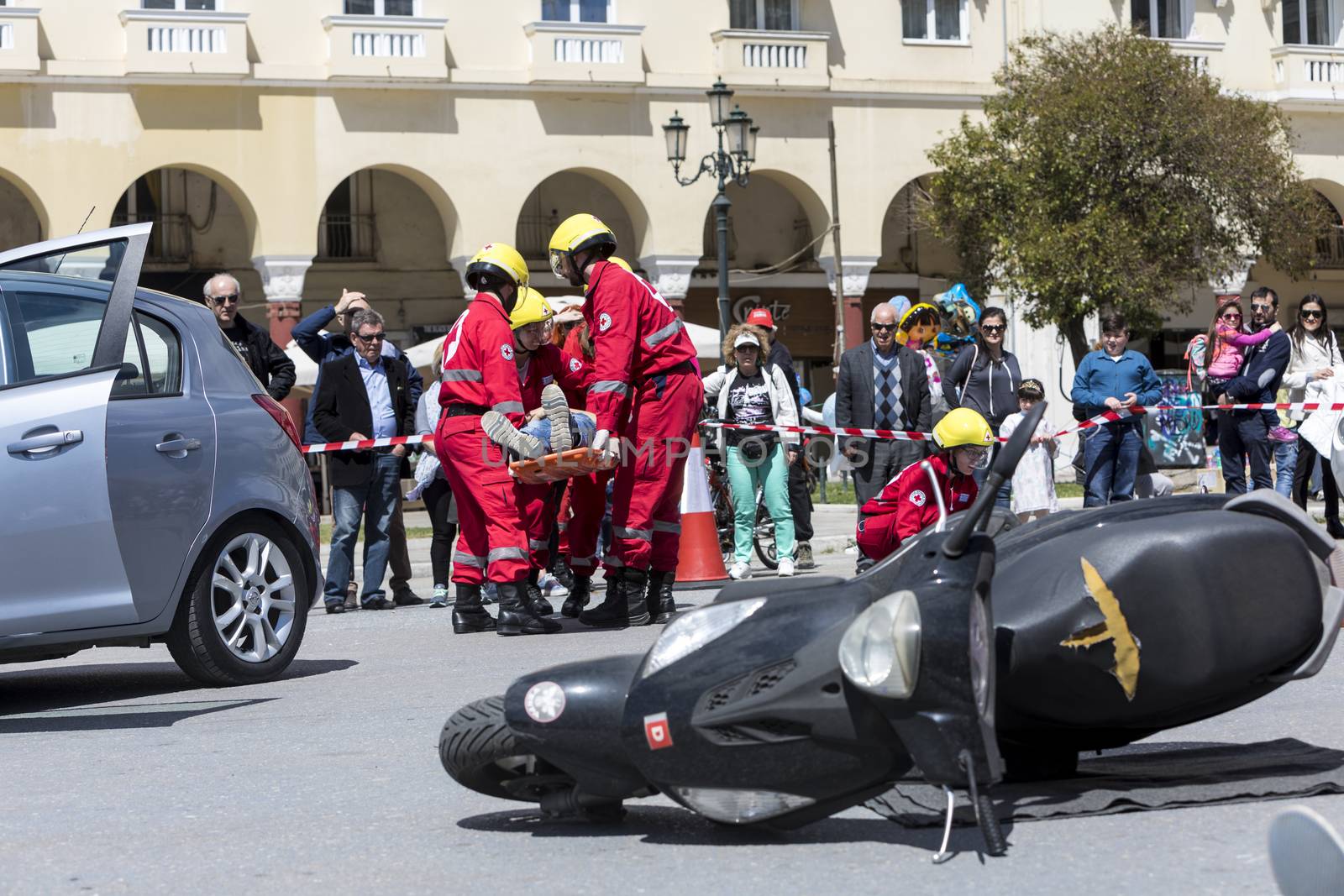 Thessaloniki , Greece - April 9, 2017: First aid, victim liberation in an car accident and helmet removal demonstration by the Hellenic Red Cross rescue team