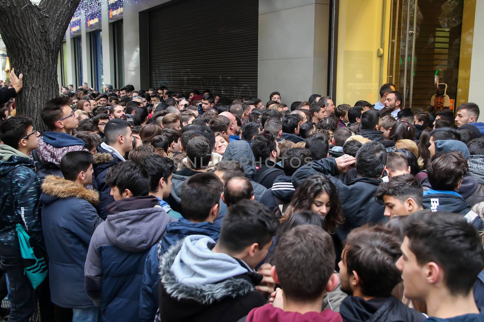 Thessaloniki, Greece - November 25, 2016. People wait outside a department store during Black Friday shopping deals, at the northern Greek city of Thessaloniki.