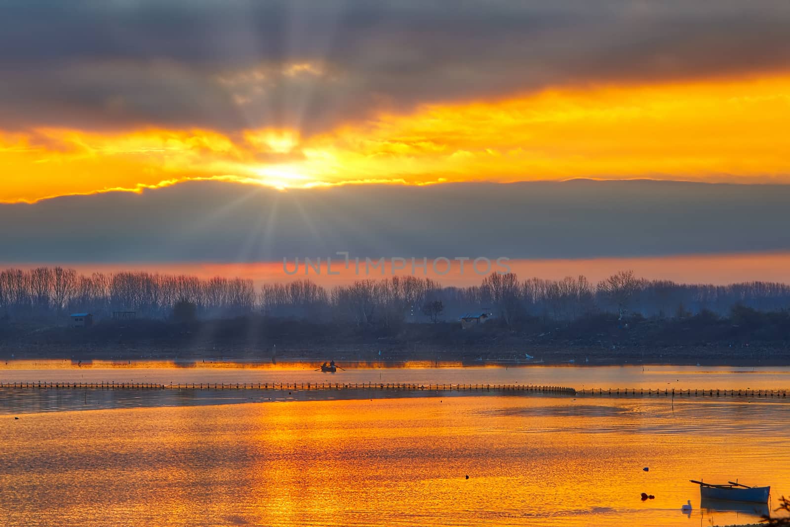 Sunrise over the wetland of Kerkini Lake one winter day in northern Greece. atmospheric effect