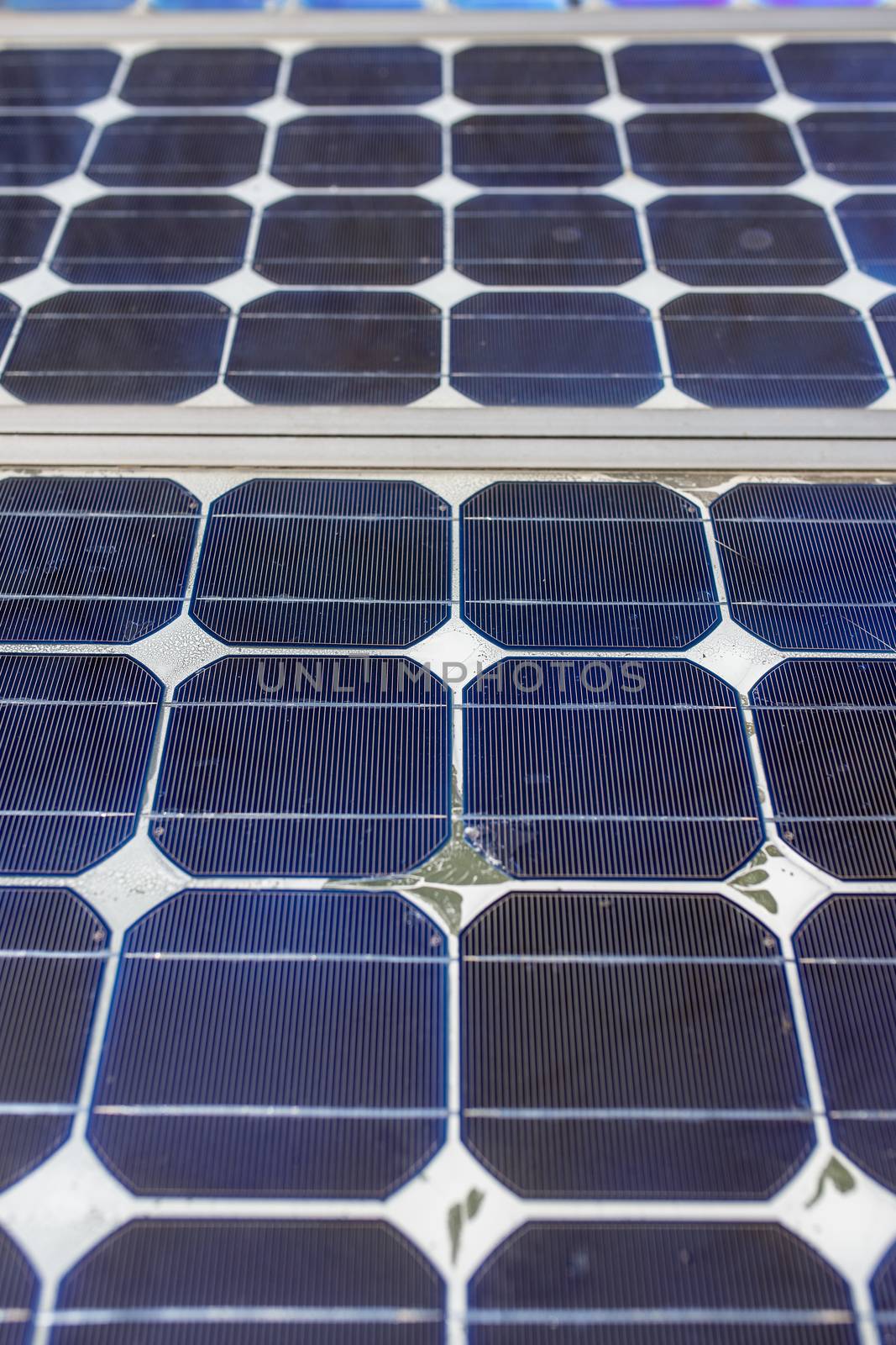 Old small solar panels gate house opening photovoltaic electric system for home in village.